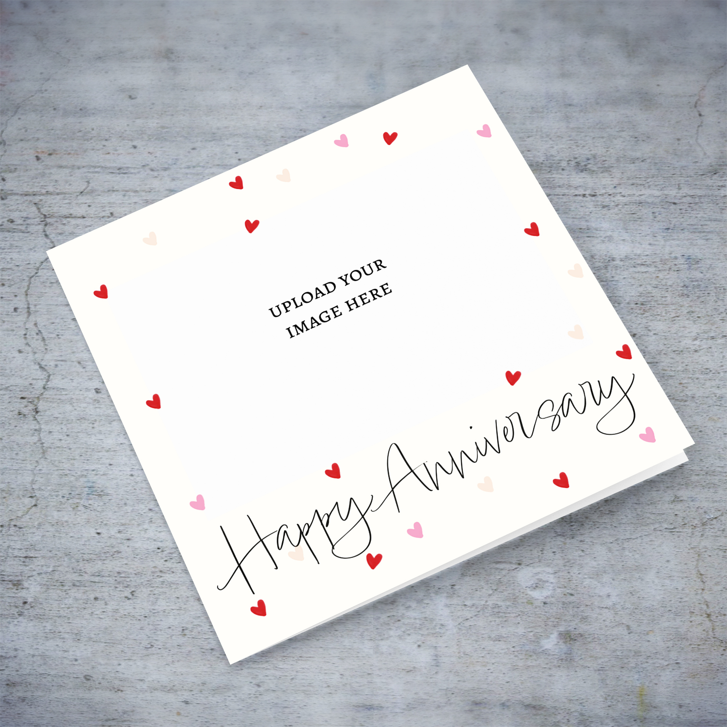 A cute photo Anniversary card in a neutral cream colour background with scattered red and pink hearts in English (Blank message)