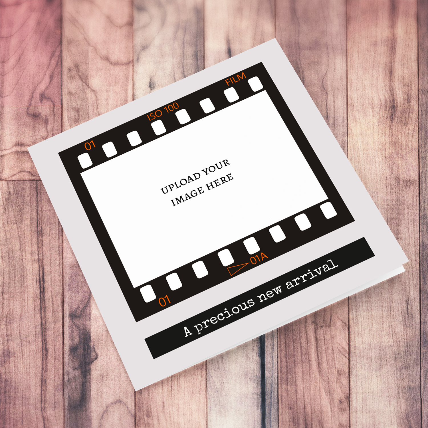 A photo new born card featuring a black photo film reel to upload photo into and a neutral background in English