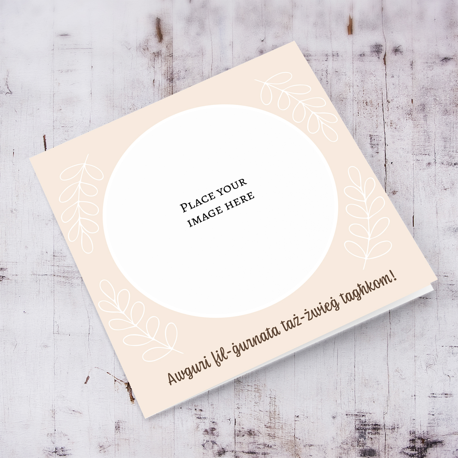 Minimalist circle photo wedding card in light peach coloured background with white leaves in Maltese 