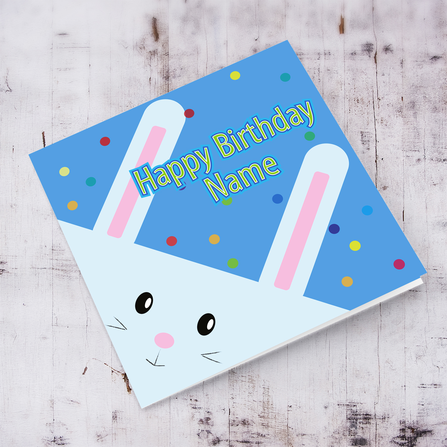 A cute rabbit themed birthday card with colourful dotted background in blue, in English