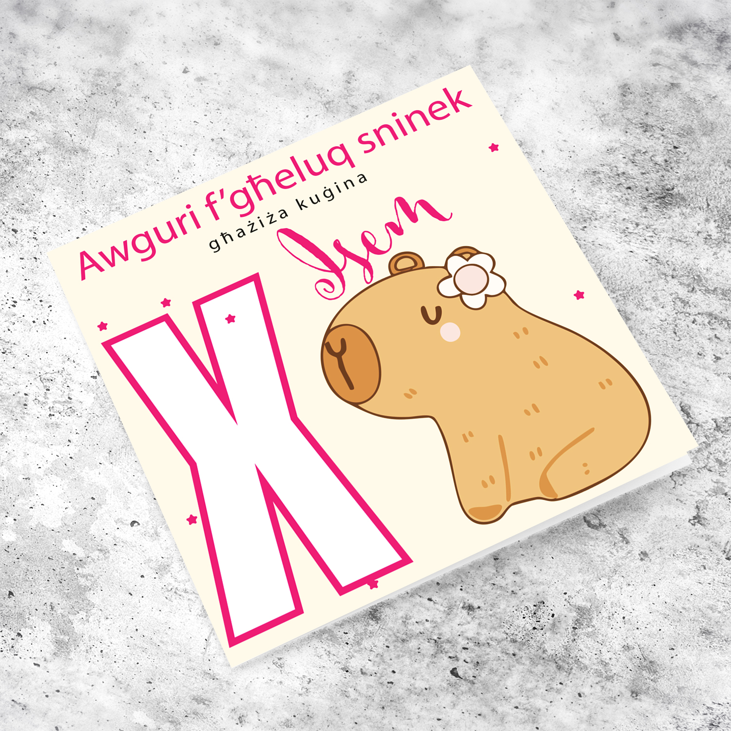 A cute birthday card for cousin featuring a capybara wearing a flower, personalisable with name and age in pink tones in Maltese (Personalisable + Enter Age)