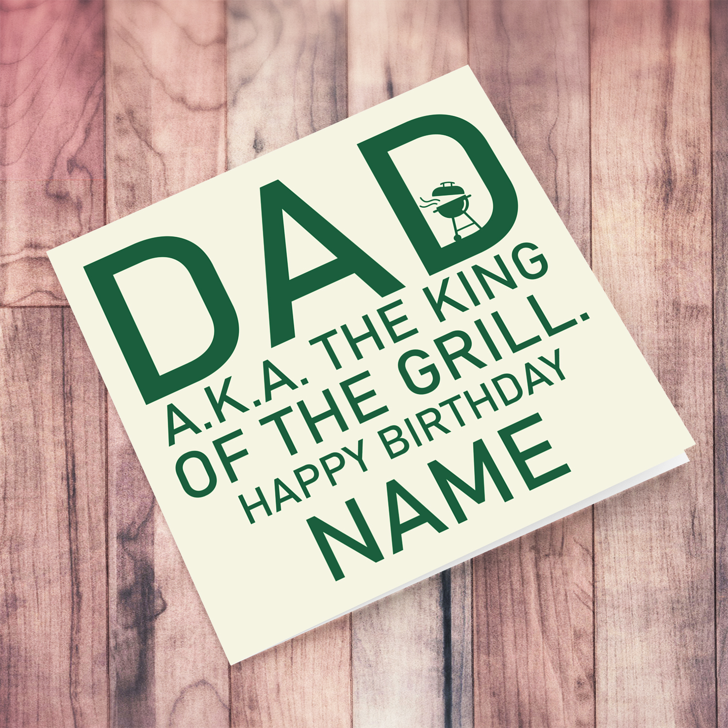 Birthday card in light background and green text - Dad A.K.A. the king of the grill in English (Personalisable)