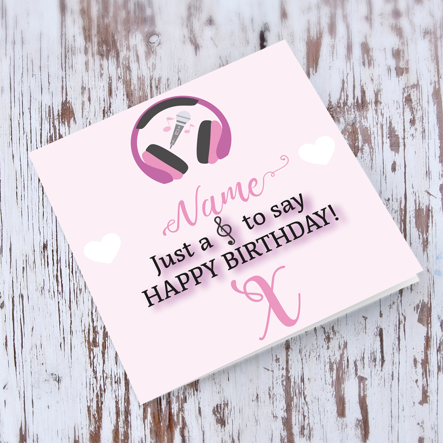 Music themed birthday card - ( headphones, microphone and musical note ) in pink background and white hearts in English