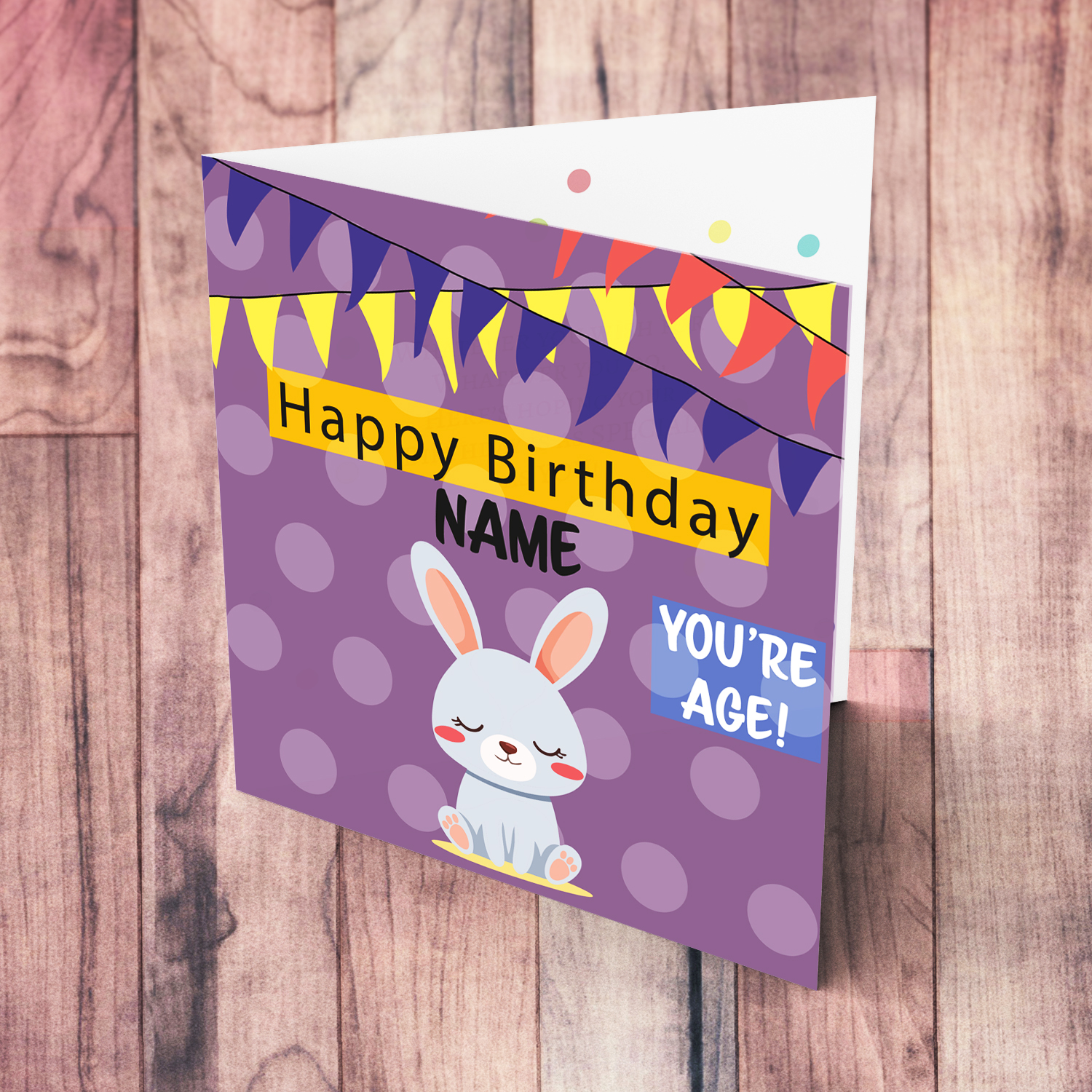 A cute bunny themed birthday card in purple spotted background with colourful bunting in English