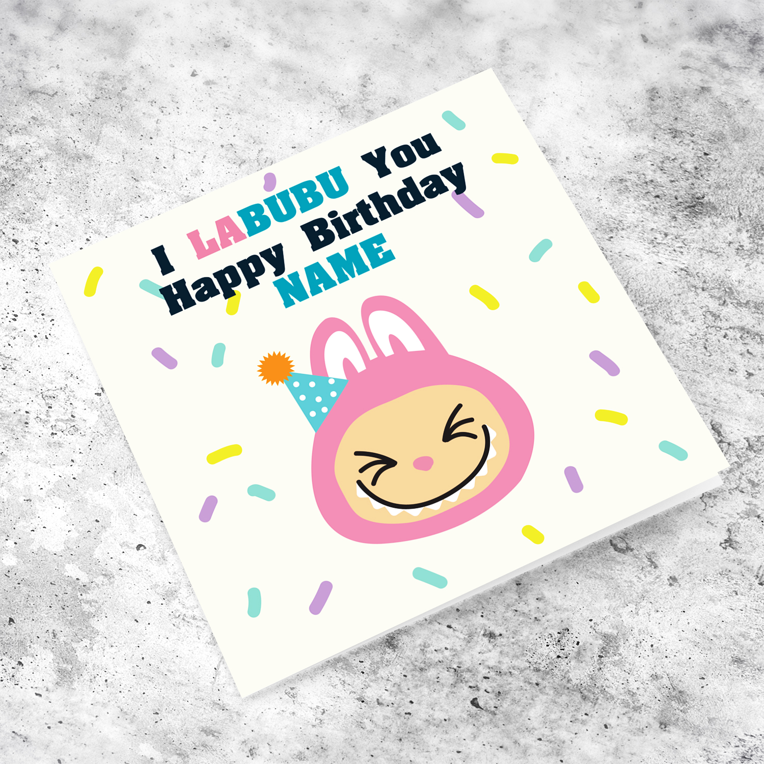 Pink labubu themed birthday card featuring a pink labubu wearing a party hat, and scattered colourful confetti - I labubu you - in English (Personalisable) 