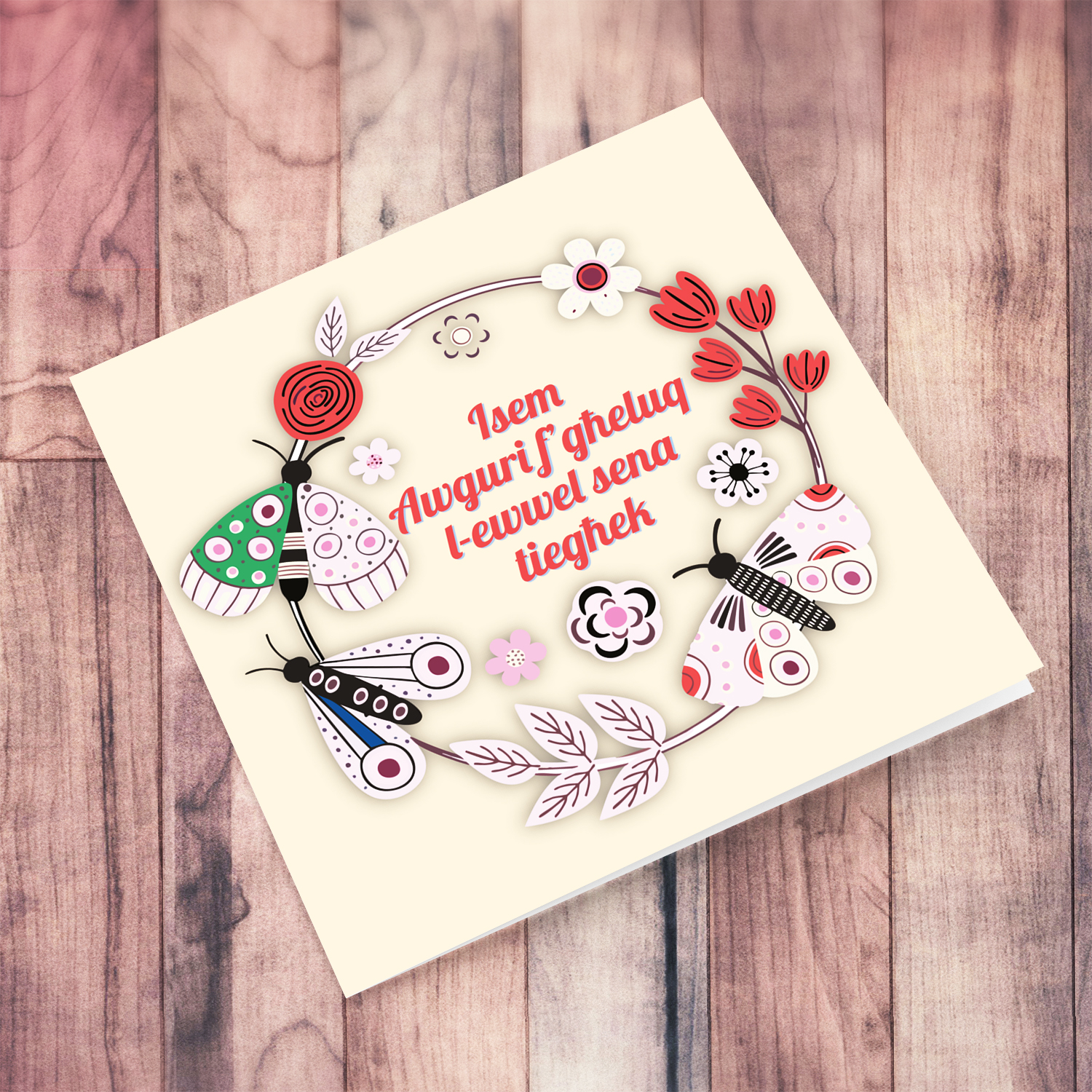 A cute FIRST birthday card in light colours, featuring a butterfly & flower wreath in Maltese (Personalisable)