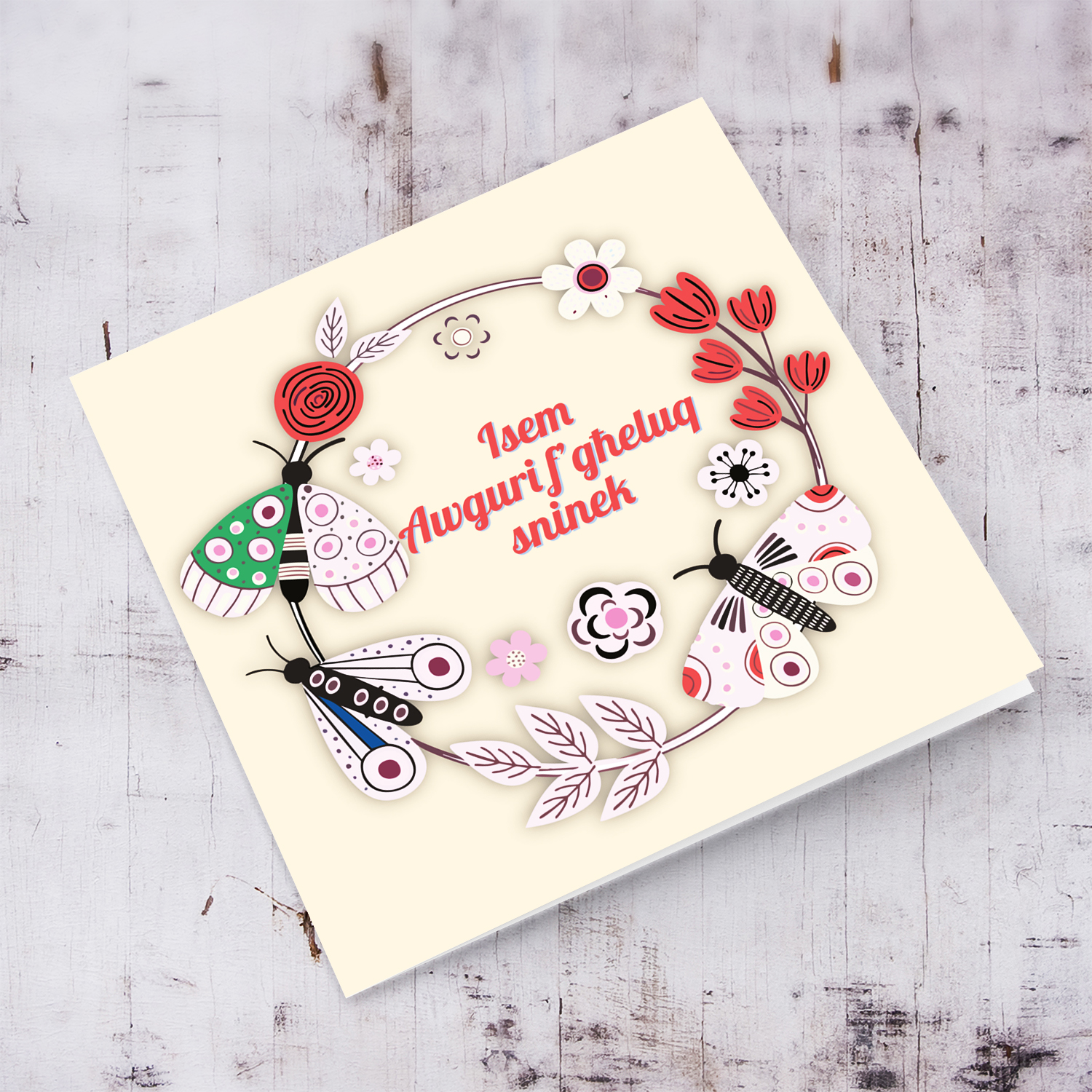 A cute birthday card in light colours, featuring a butterfly  & flower wreath in Maltese (Personalisable)
