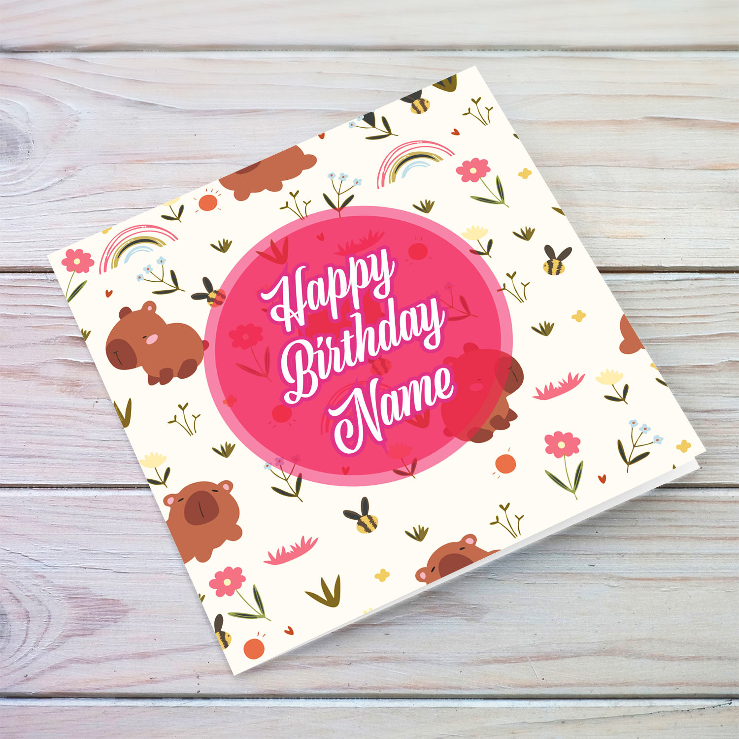 A light background featuring capybaras, rainbows and flowers - birthday card in English (Personalisable)