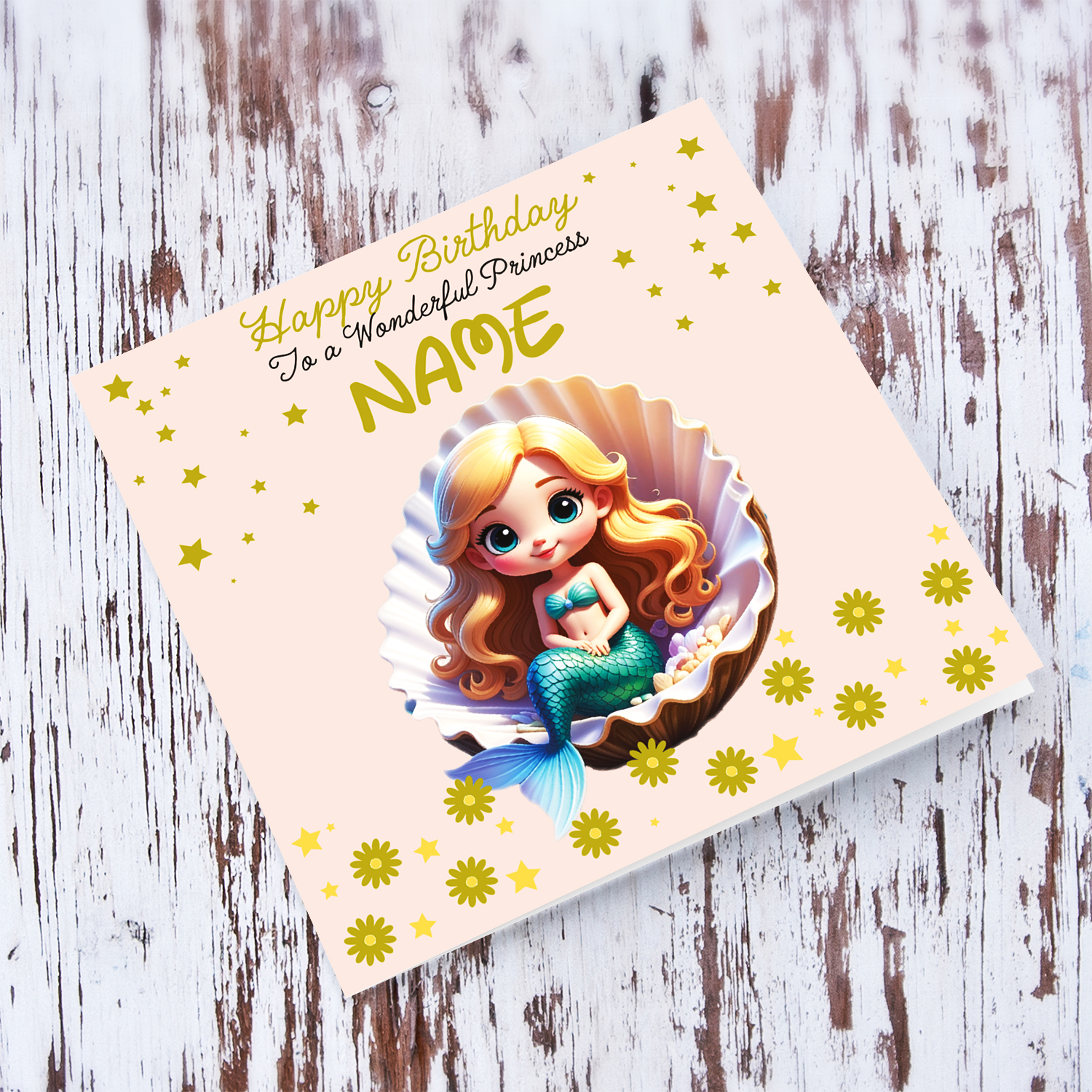 A cute birthday card in light pink background with a blonde haired mermaid, sitting in an oyster shell, with golden stars and flowers in English