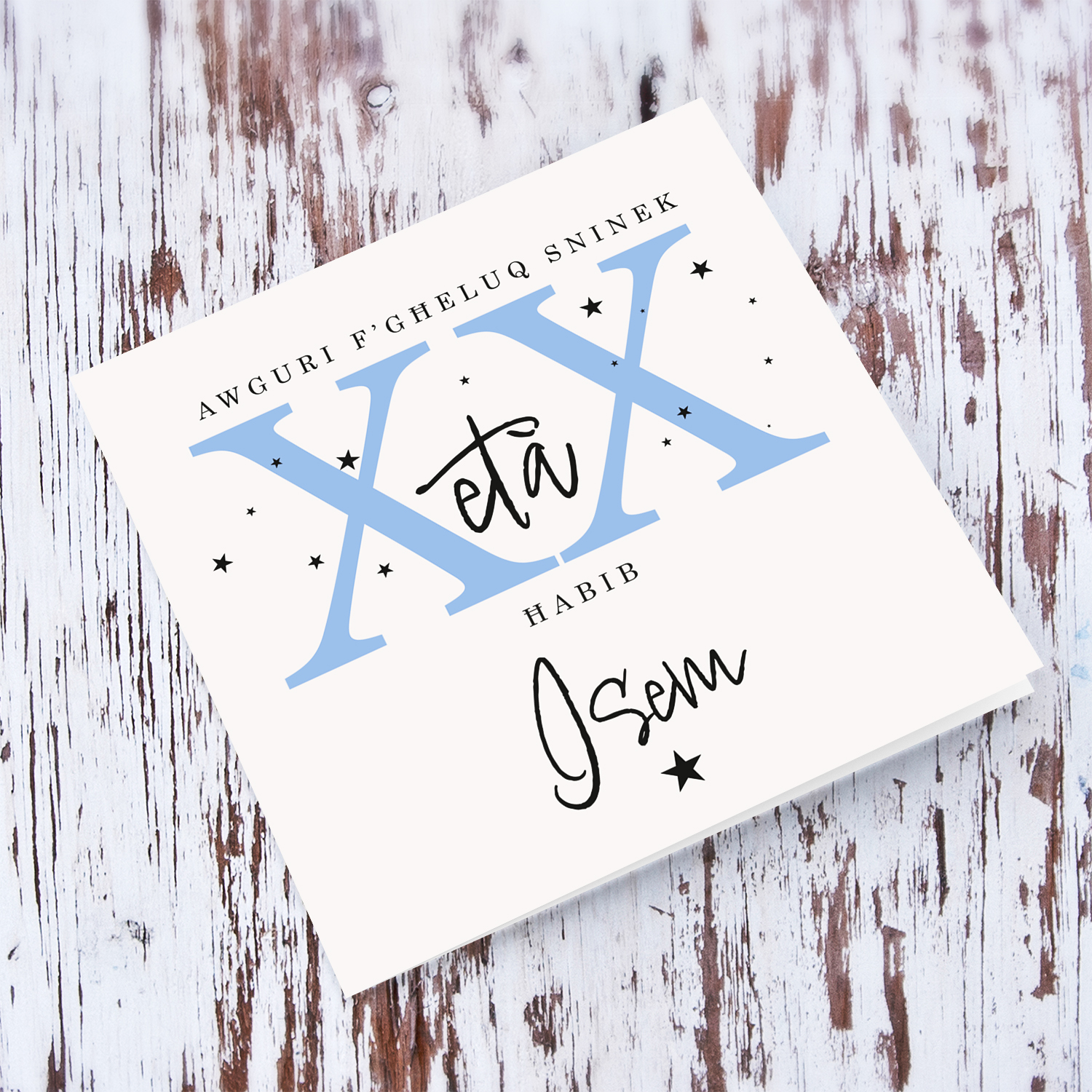 A beautiful birthday card for a male friend in a neutral background with scattered black stars, and age in light blue - with personalisable Name & Age in Maltese