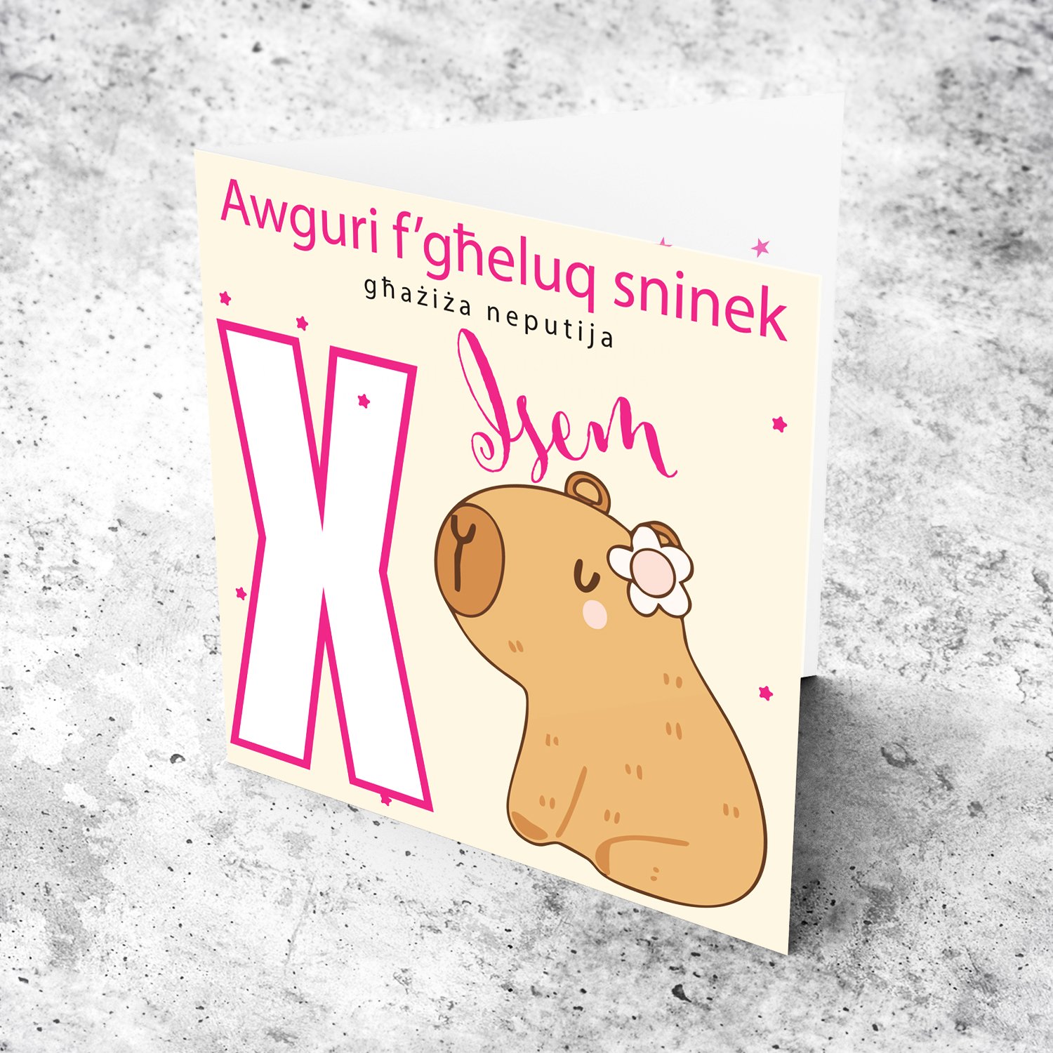 A cute birthday card for niece featuring a capybara wearing a flower, personalisable with name and age in pink tones in Maltese (Personalisable + Enter Age)