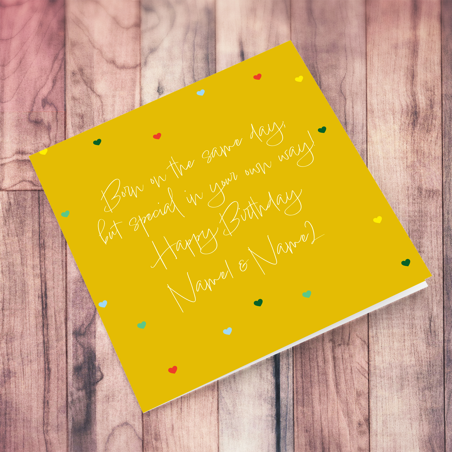 Birthday card for twins (unisex & neutral) with a yellow background and scattered hearts in English