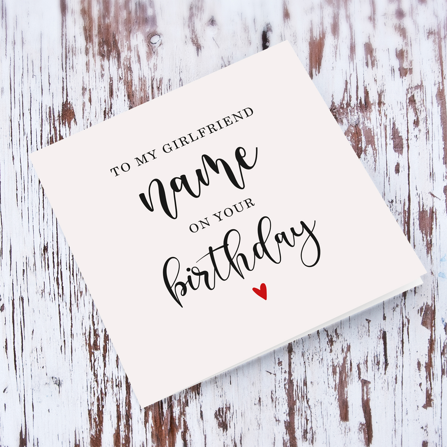 To my girlfriend on your Birthday greeting card in neutral background with red heart in English