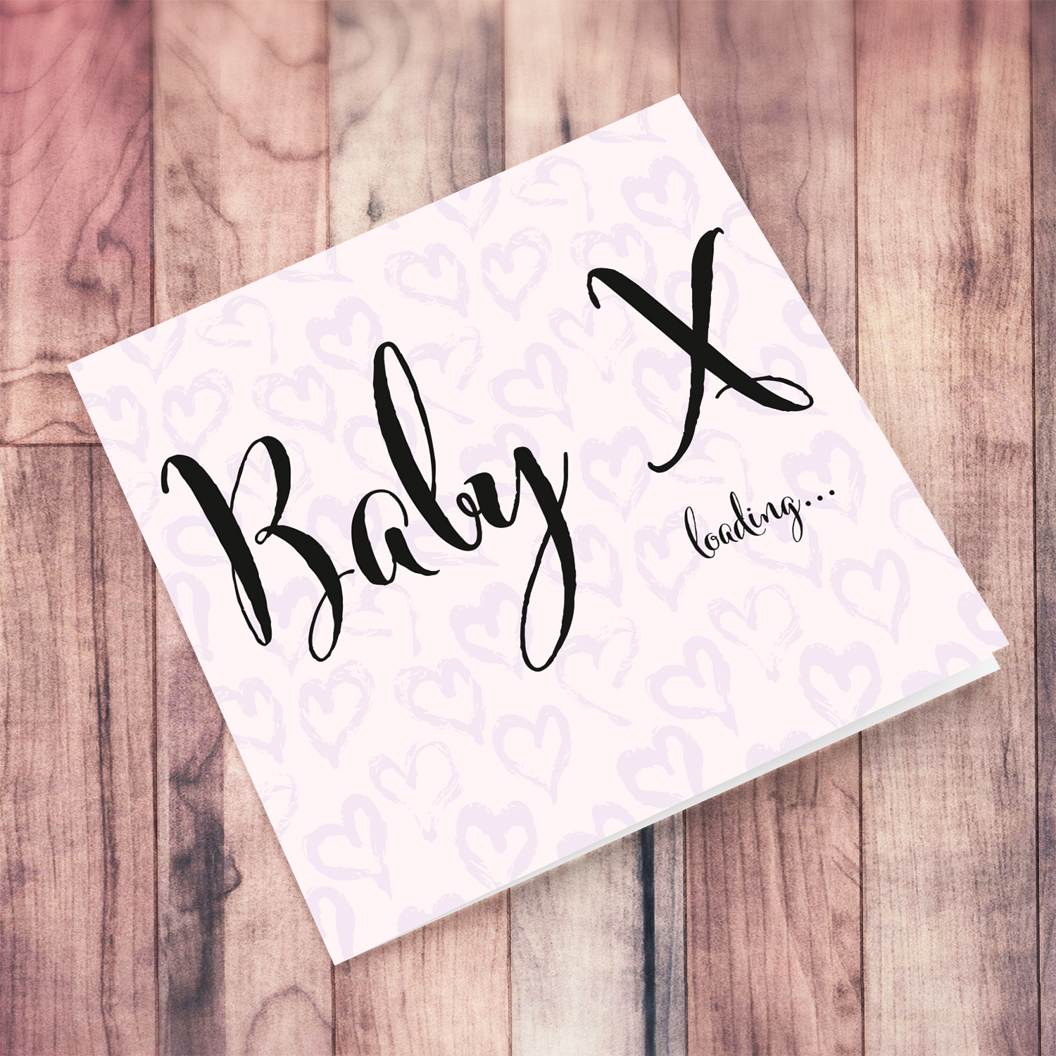 Pink background with scattered heart greeting card with Baby Initial Loading in English
