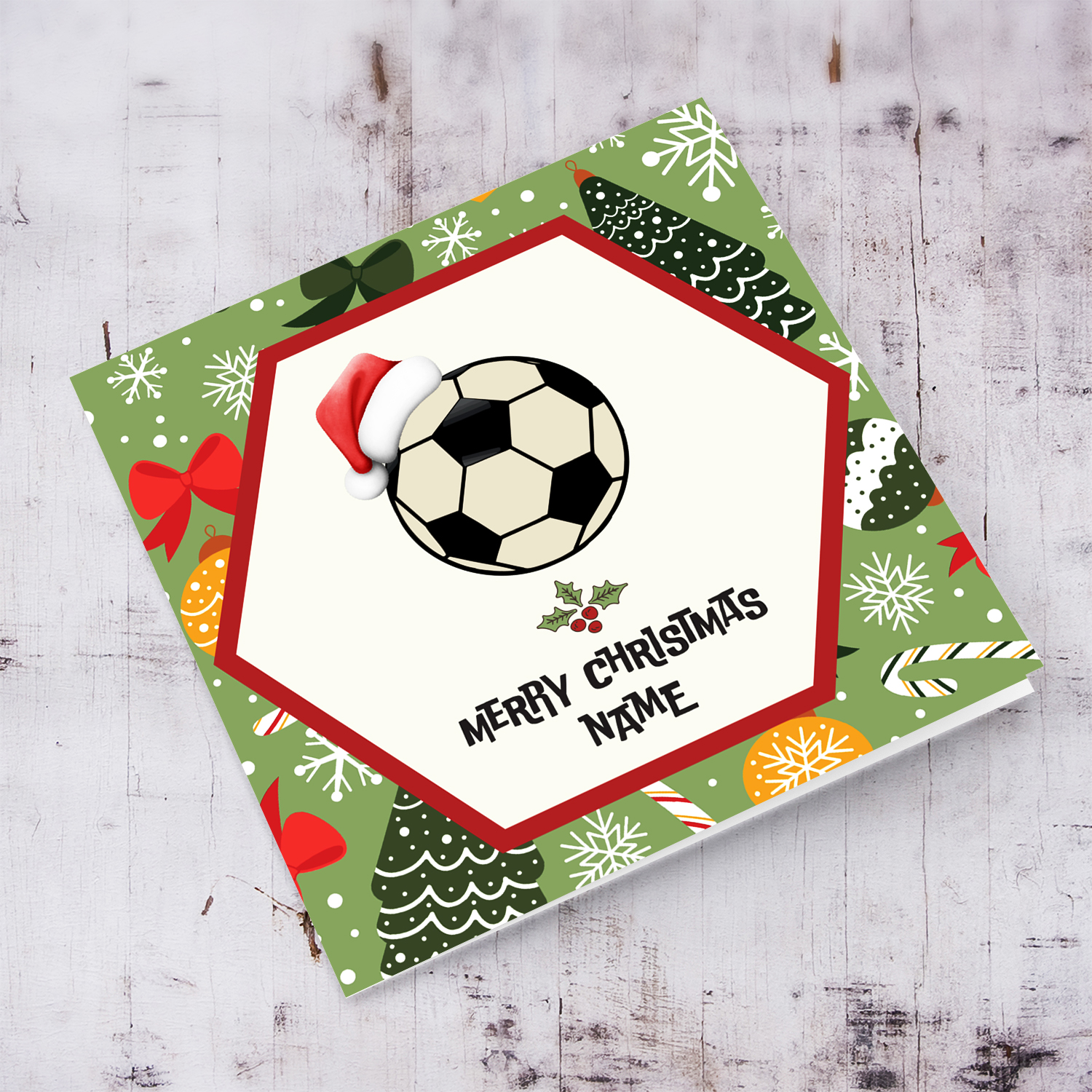 A greeting card for a football fan, featuring a ball with Santa's hat, holly and a Christmas background  in English (Personalisable)