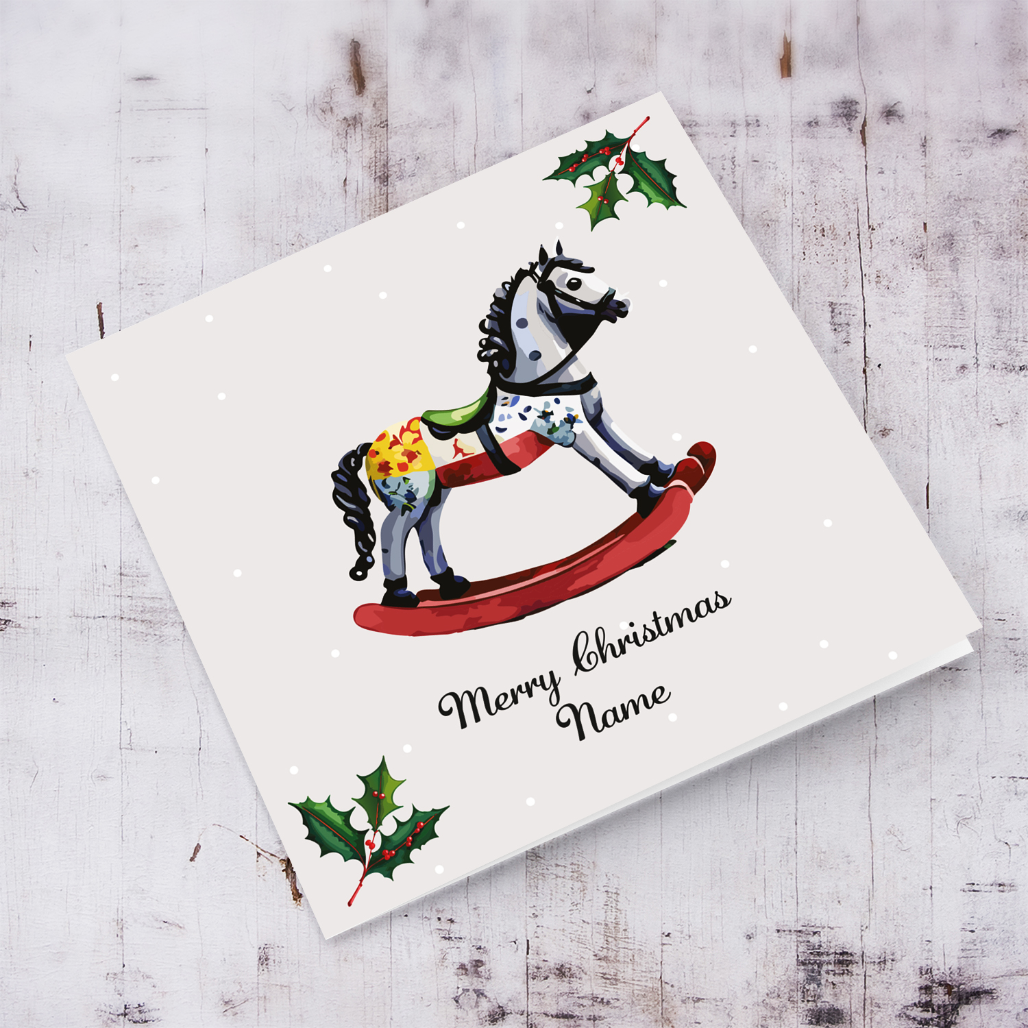 Cute rocking horse themed Christmas card with hollies in English (Personalisable)