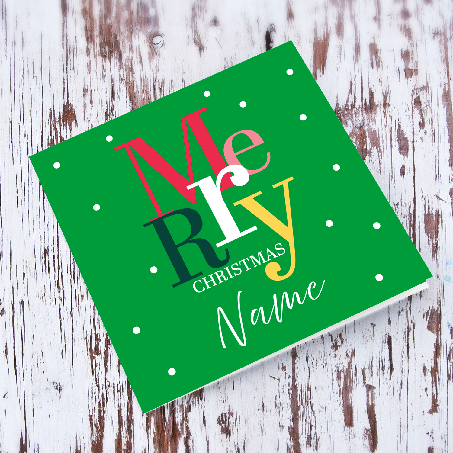 A cheerful open Christmas card with a festive green background and colourful text in English (Personalisable)