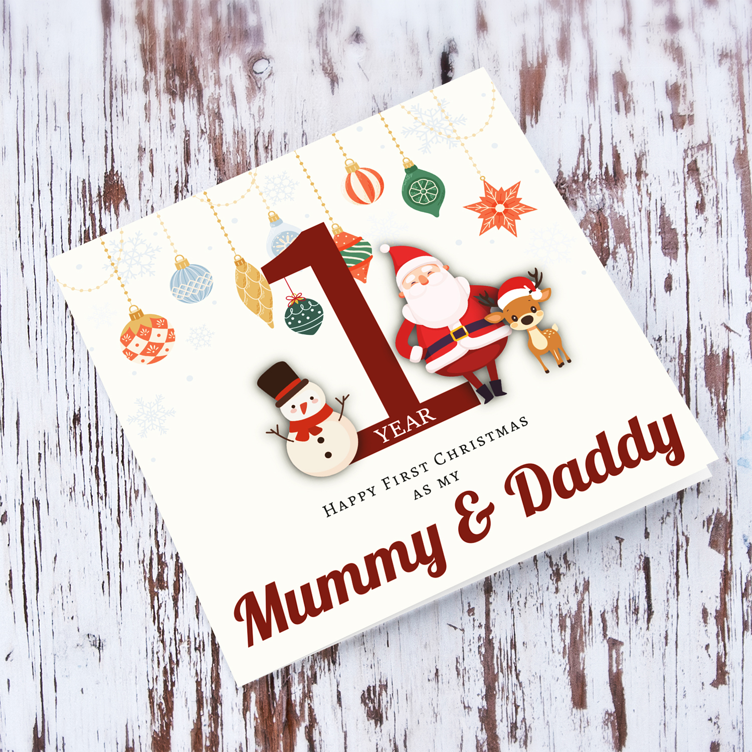A special First Christmas card, featuring hanging baubles with a cute snowman, santa, and reindeer for Mummy & Daddy in English