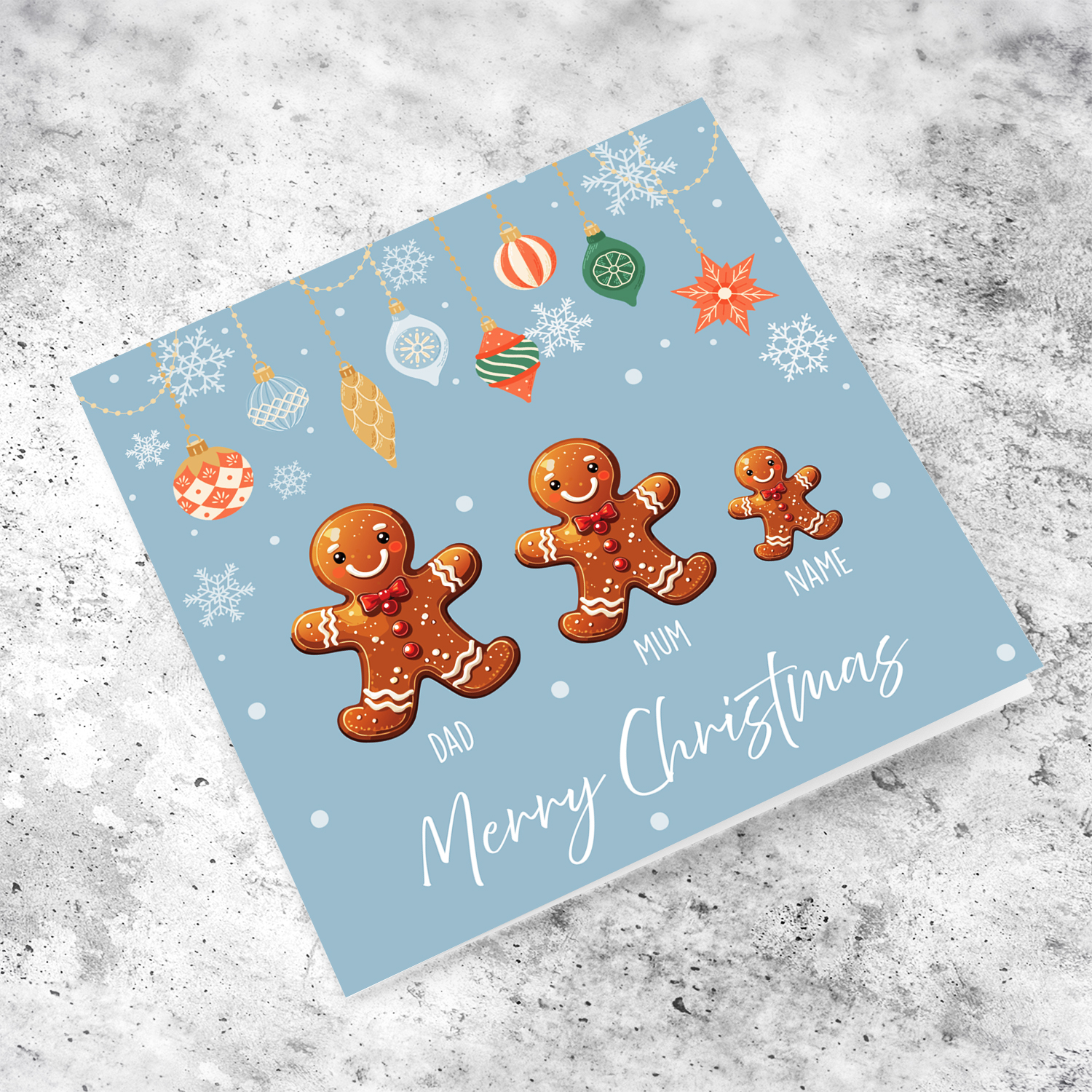 A cute Christmas card, featuring a family of ginger breadman with 1 child, hanging snowflakes in English (Personalisable)