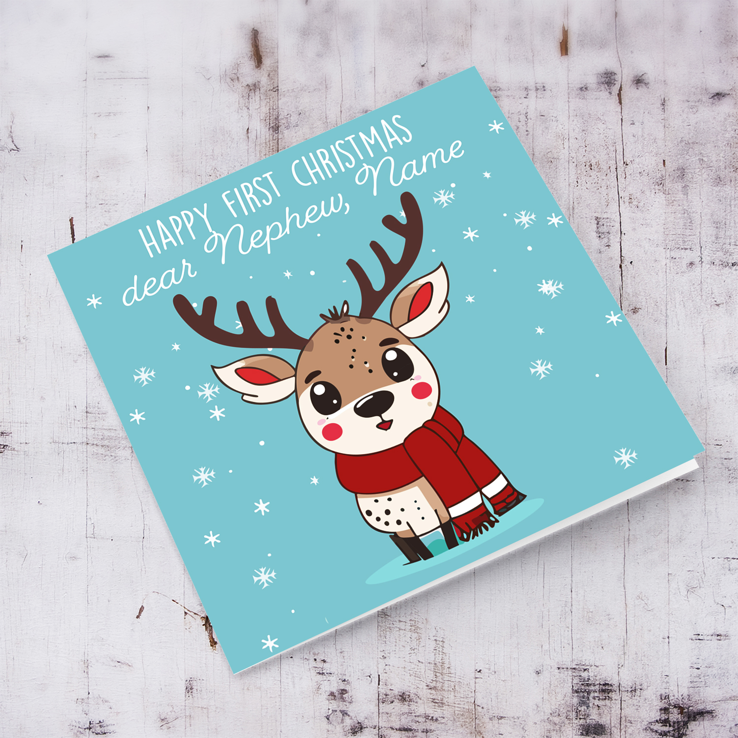 Nephew - First Christmas dear Nephew with light blue background and a cute reindeer in English