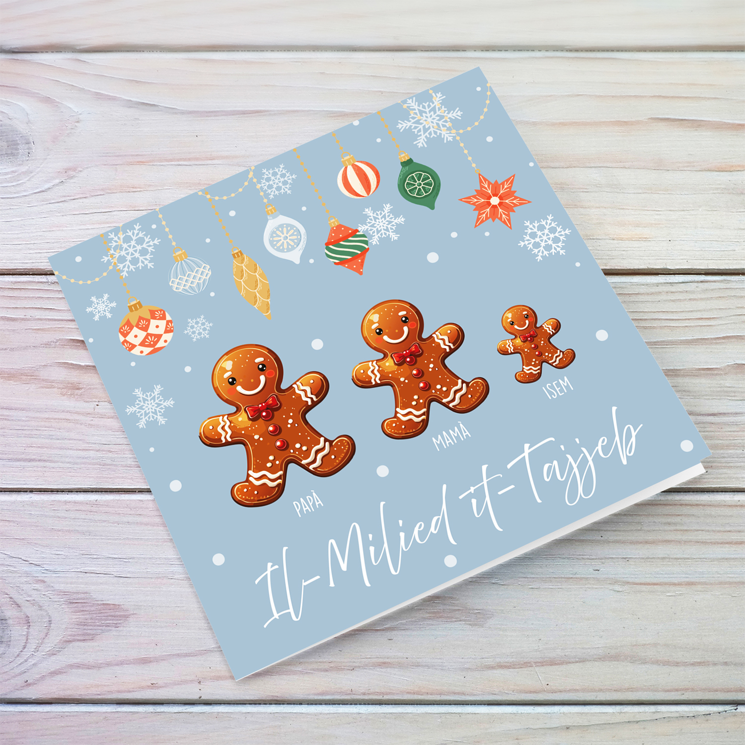 A cute Christmas card, featuring a family of ginger breadman with 1 child, hanging snowflakes in Maltese (Personalisable)
