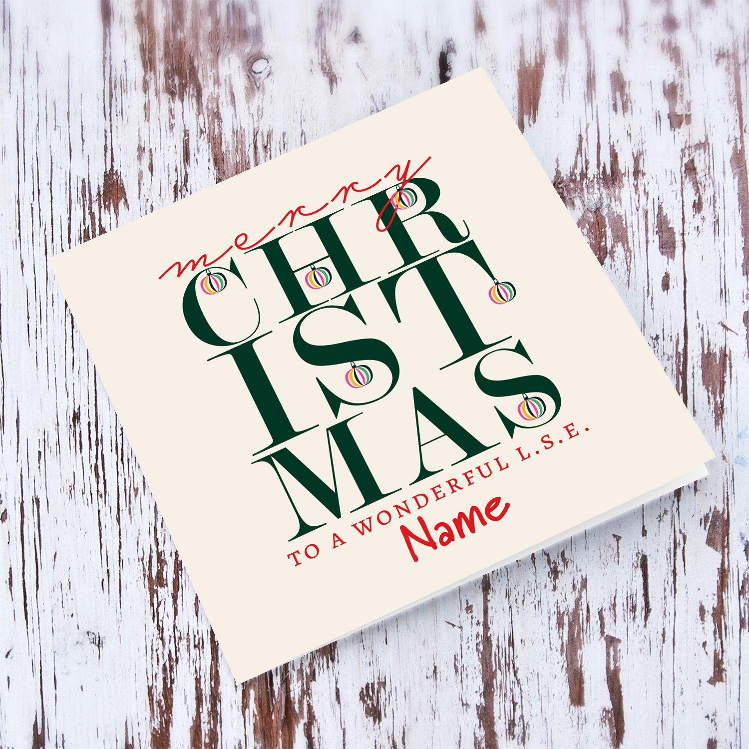 A beautiful, modern Christmas card, in the holiday's season colours with various hanging baubles for L.S.E. in English
