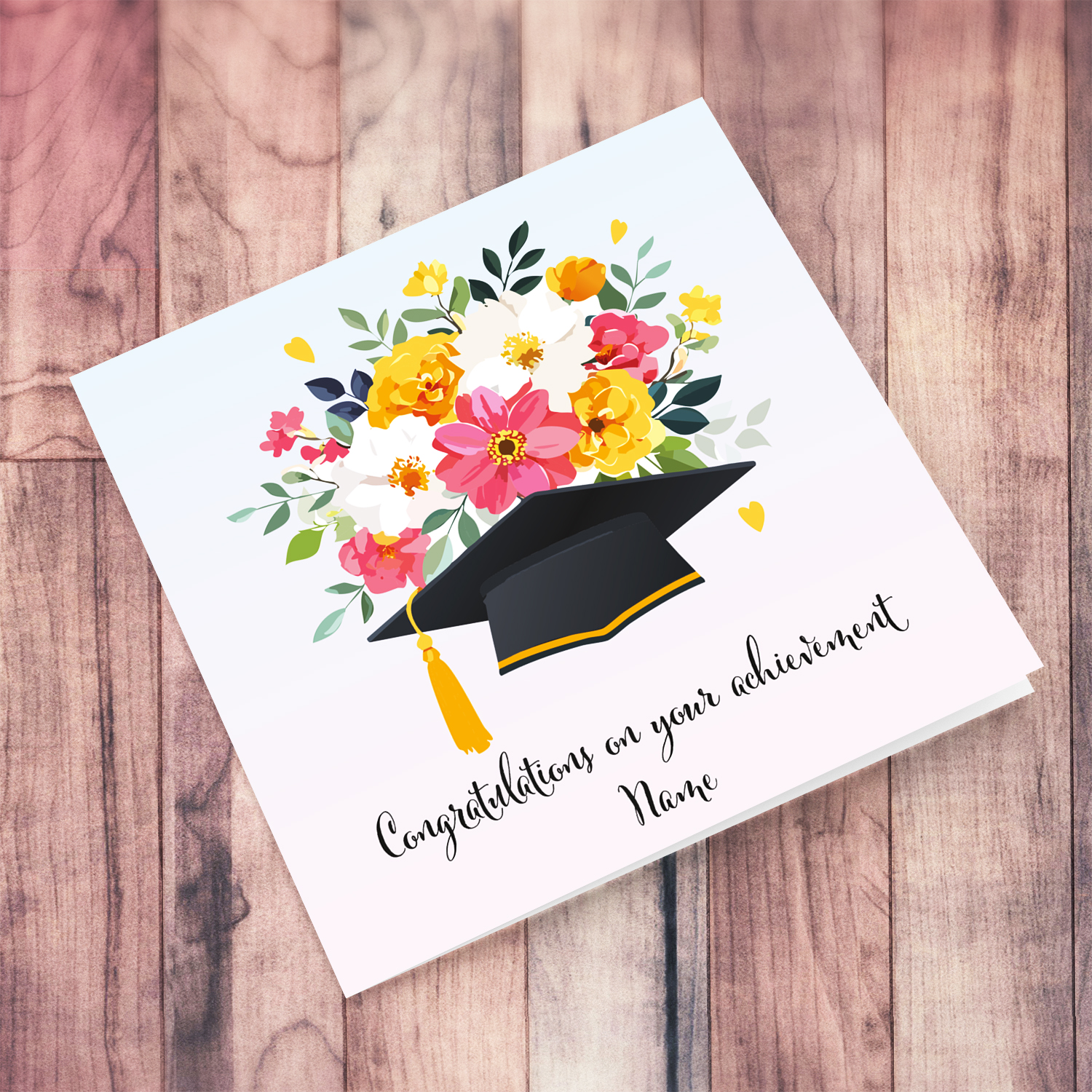 Flower themed personalisable graduation card with hat and flowers in a gradient background from light blue to light pink in English