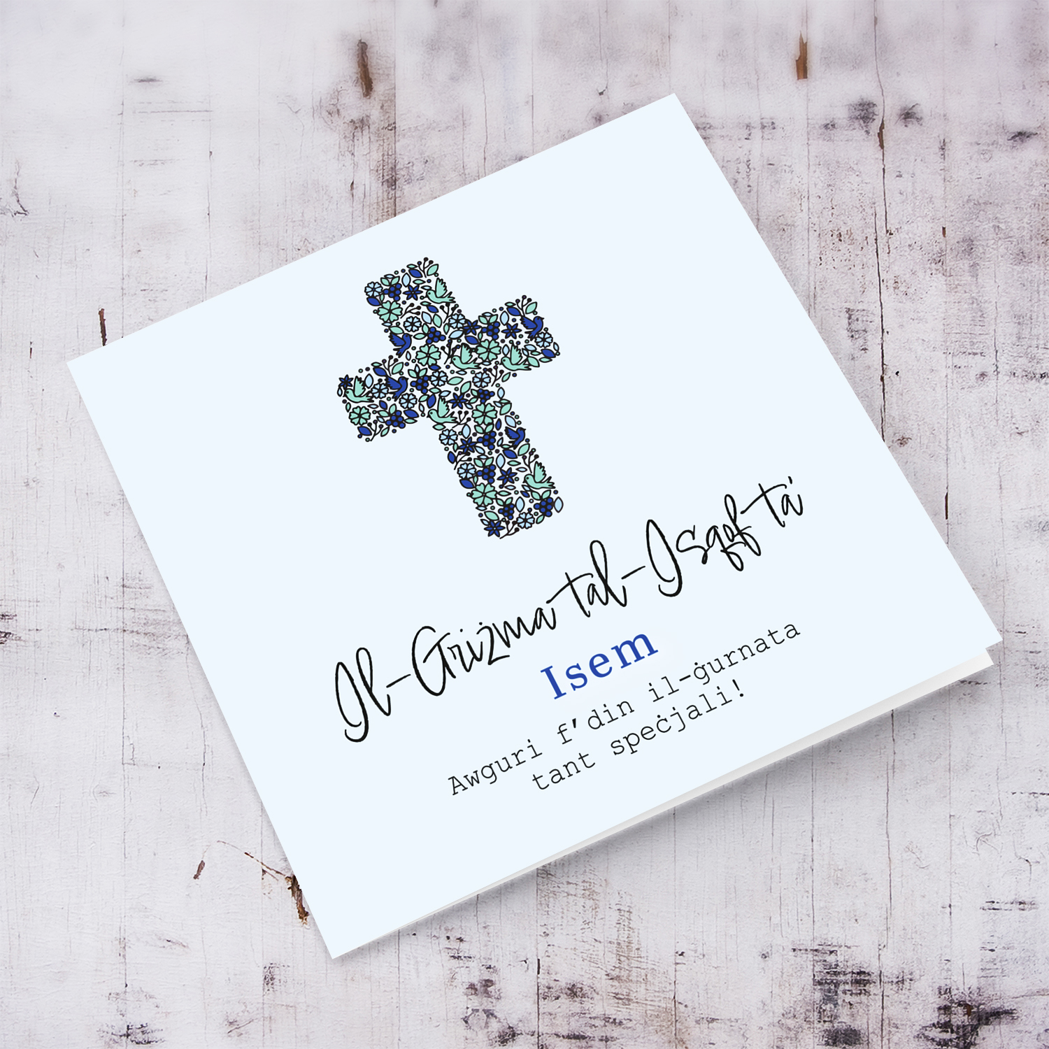 Modern Confirmation card with floral cross (with touches of blues and green) in a light blue background in Maltese