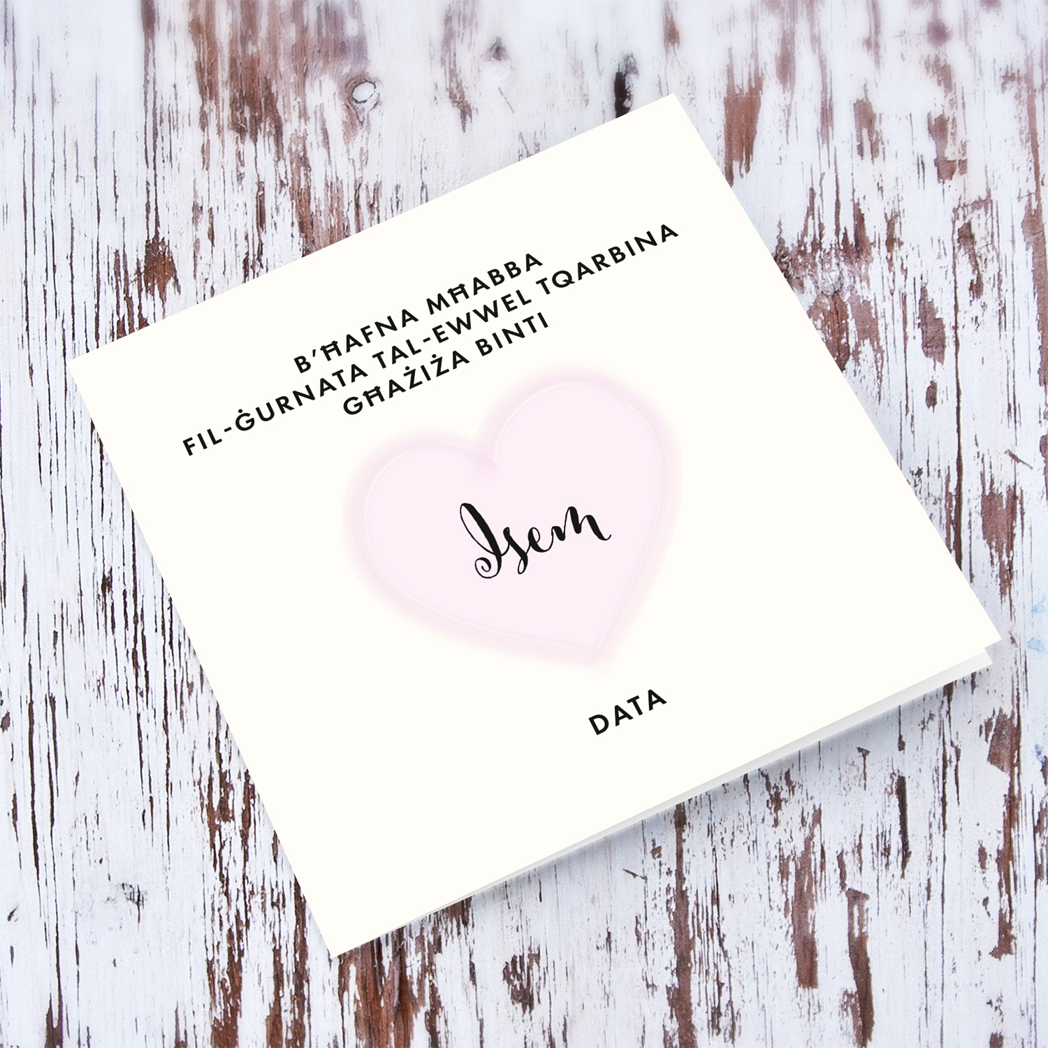 A minimalist Holy Communion card for Daughter featuring a light pink heart in Maltese (Personalisable)