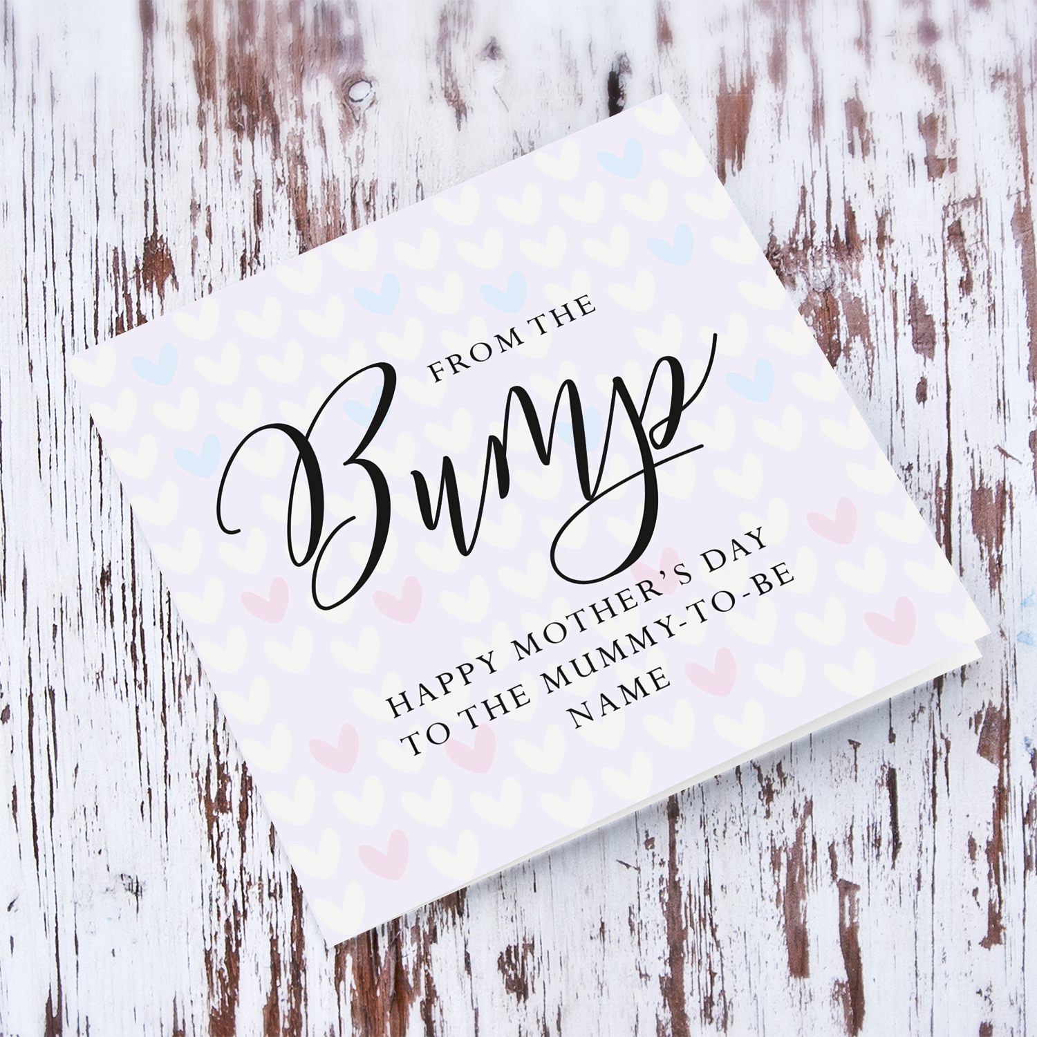 A cute mother's day card for the mummy to be from the bump, featuring a light purple background with scattered hearts in English