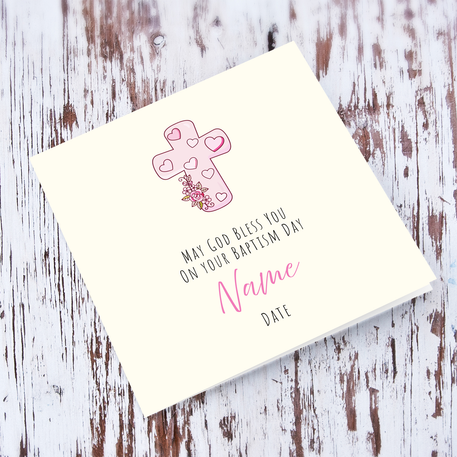 A beautiful baptism card, featuring a pink cross with cute florals in English (Personalisable)