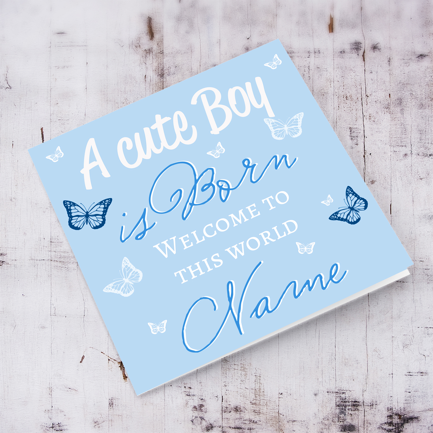 A cute baby boy is born - New born greeting card for boys in light blue background and scattered butterflies in English