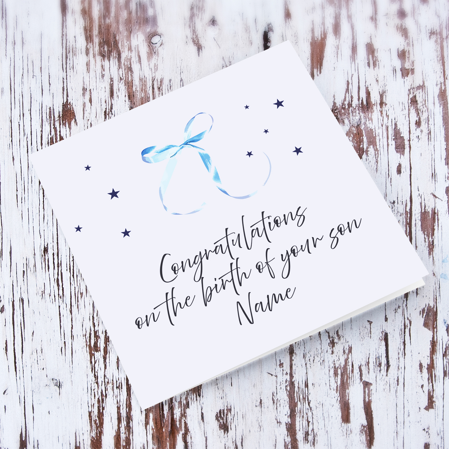 Minimalist and dainty new born card with cute blue bow and light blue background in English (Personalisable)