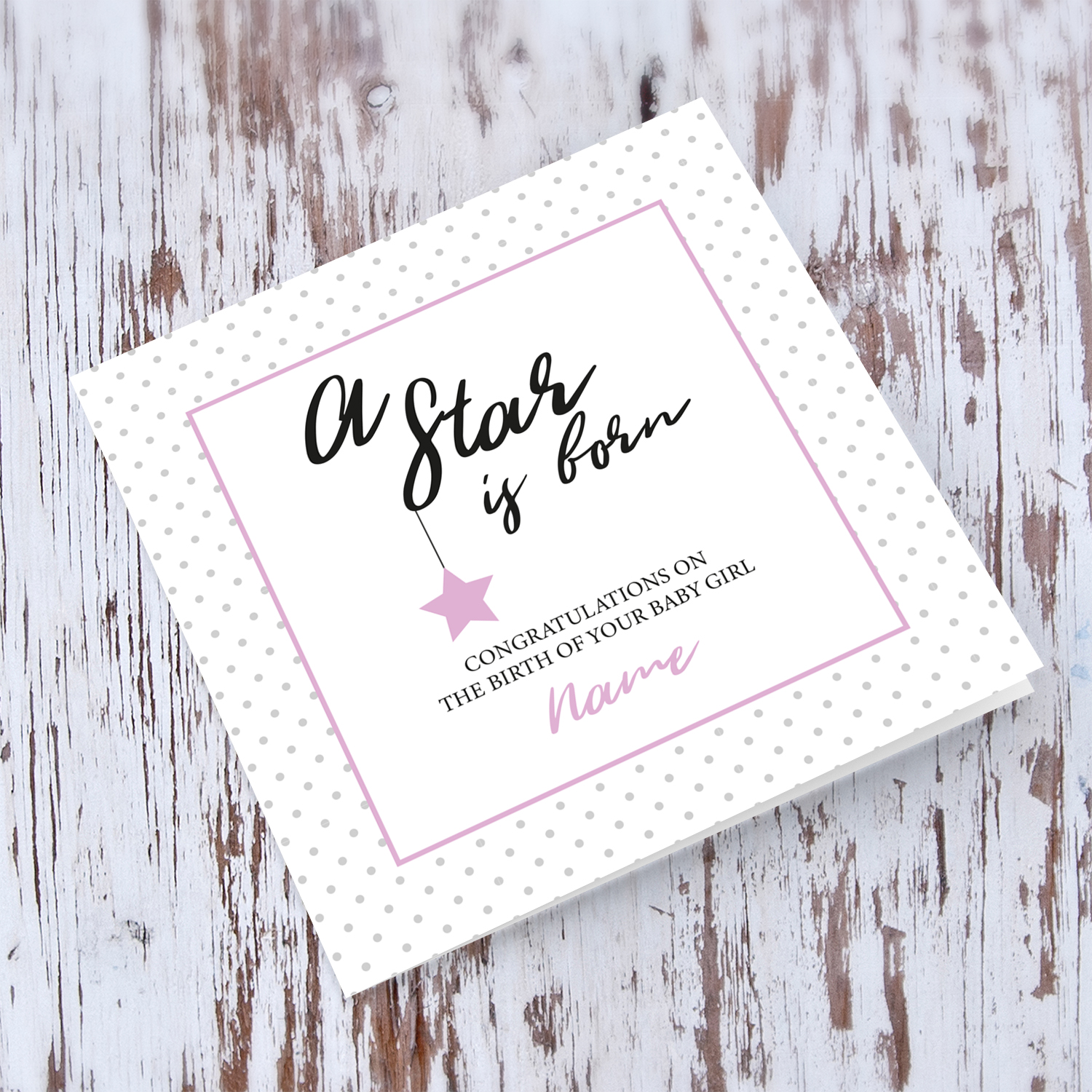 New born personalisable card for girls with polka dotted background and pink square with star in English