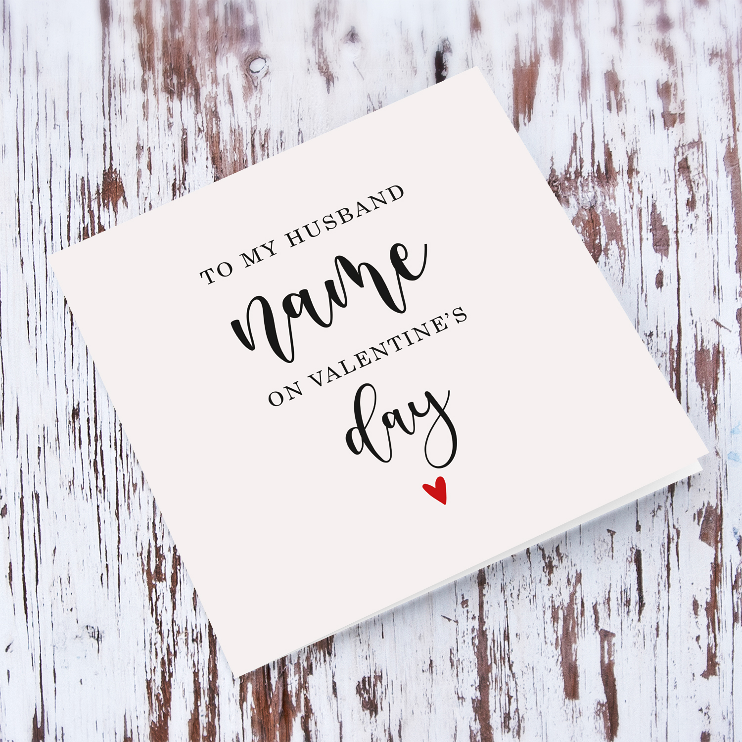 To my husband on Valentine's Day greeting card in neutral background with red heart in English