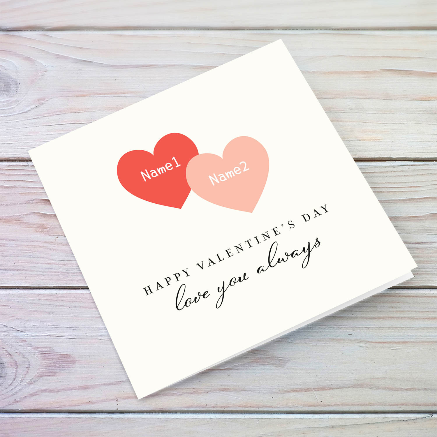 A 2 heart valentine's day greeting card in a light cream background featuring 2 hearts in different shades of red / pink in English (Personalisable)