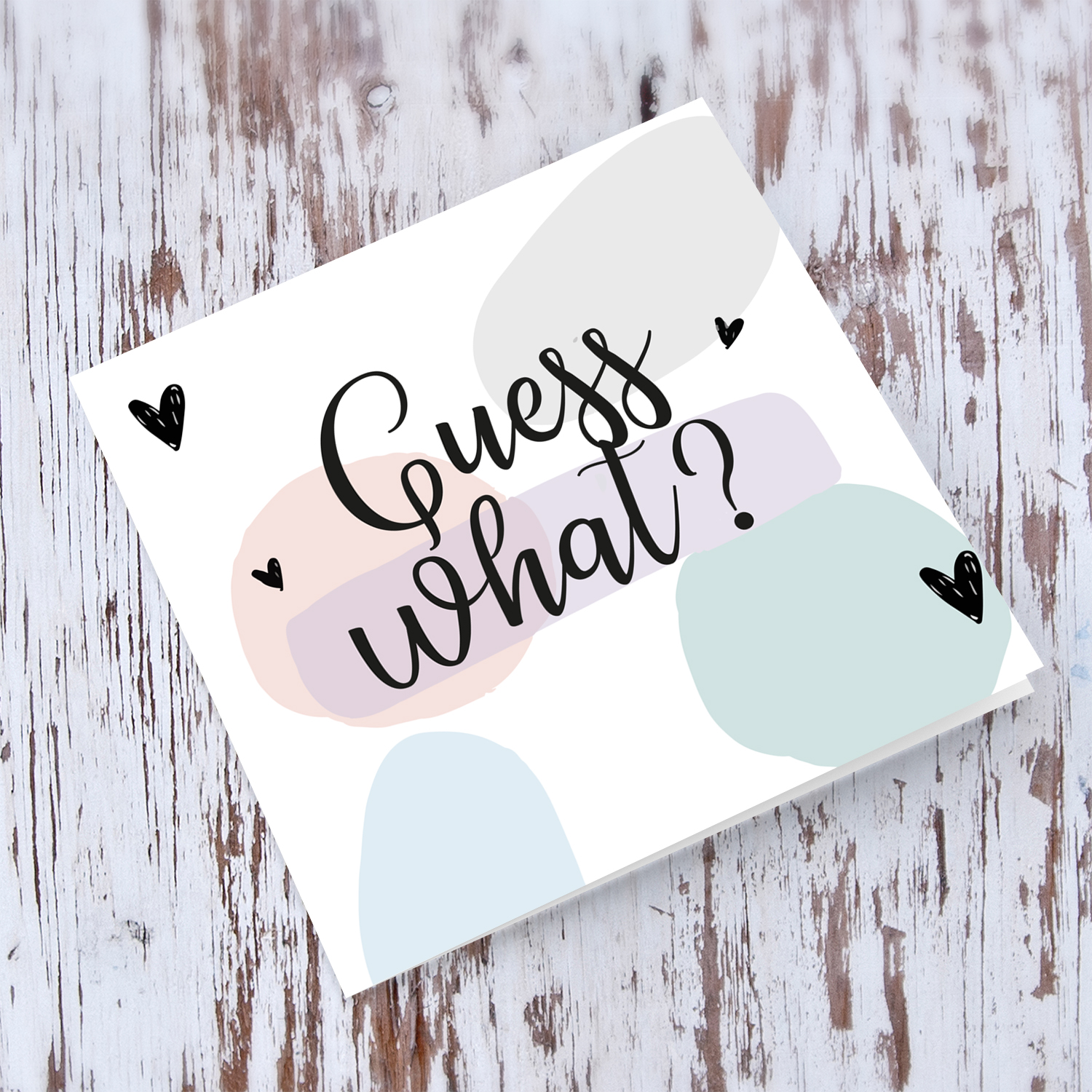 Guess what - baby/pregnancy announcement card with pastel coloured background in English