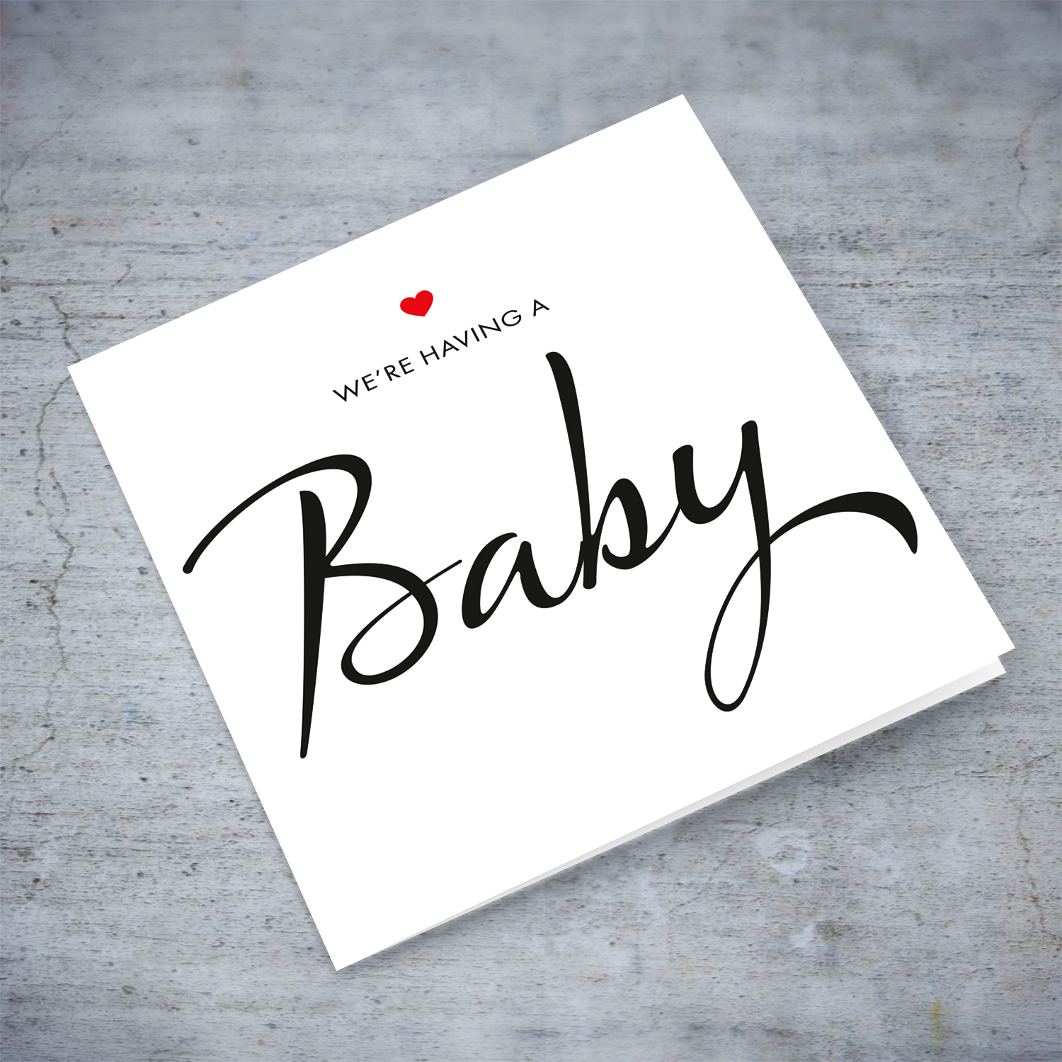 Minimalist baby announcement card with small red heart in English 