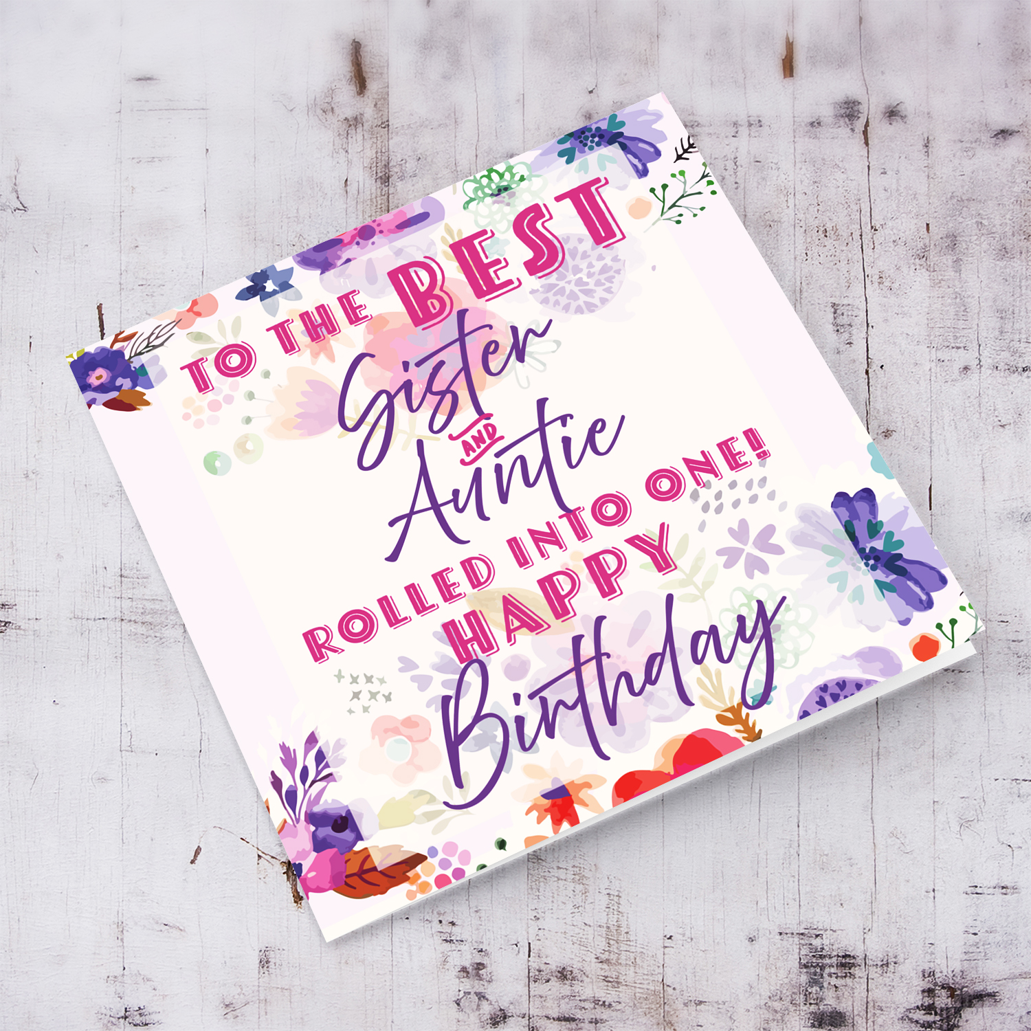 A beautiful birthday card featuring purple flowers, pink and purple text for Sister & Auntie in English
