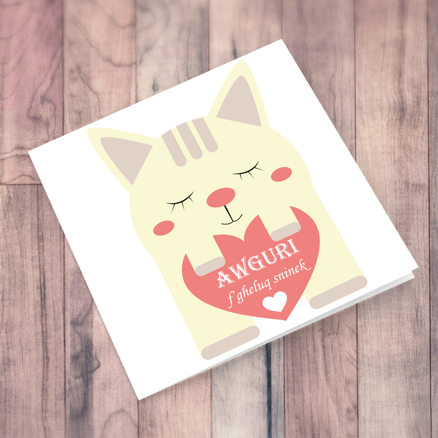 Cat birthday card holding heart in Maltese