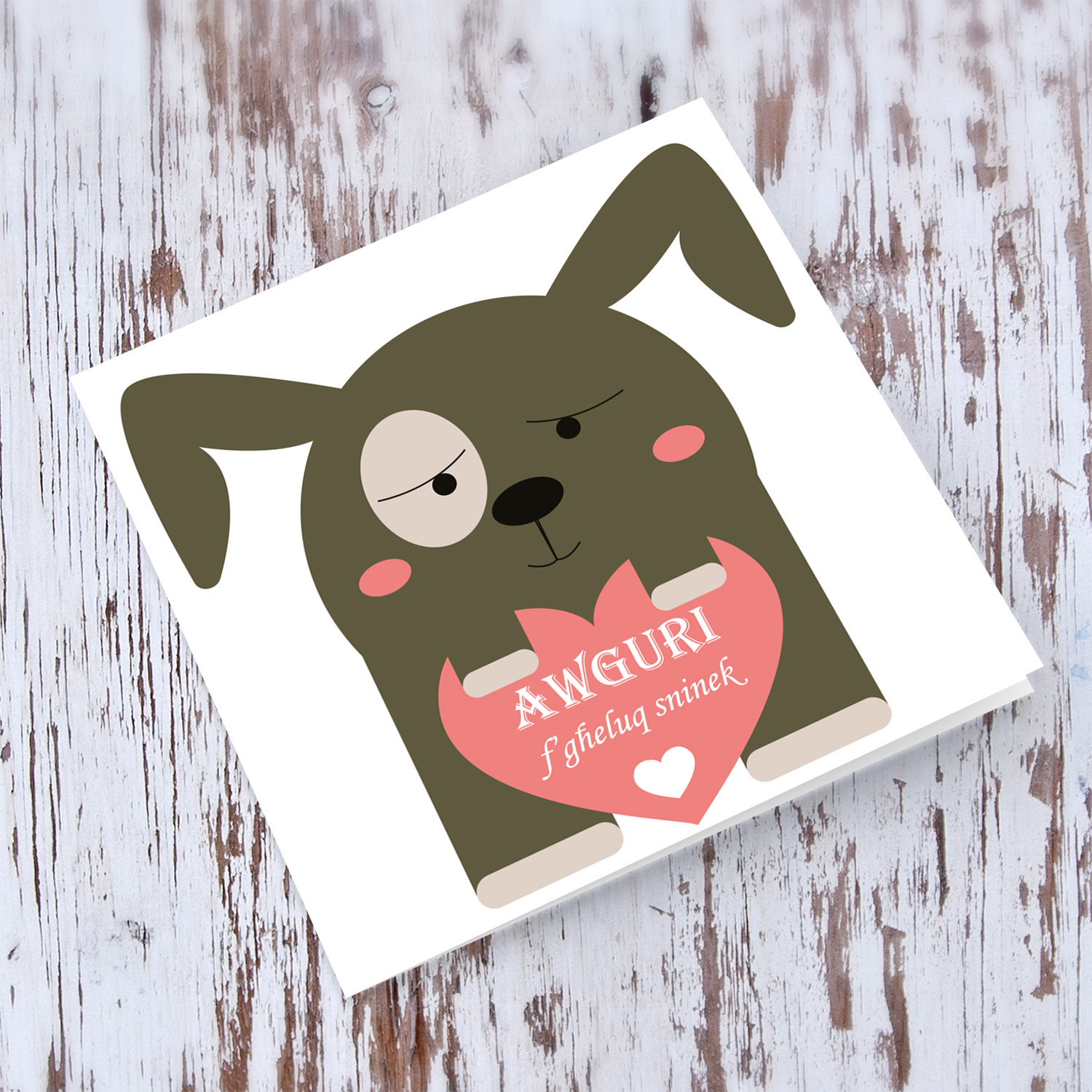Dog themed birthday card holding heart in Maltese