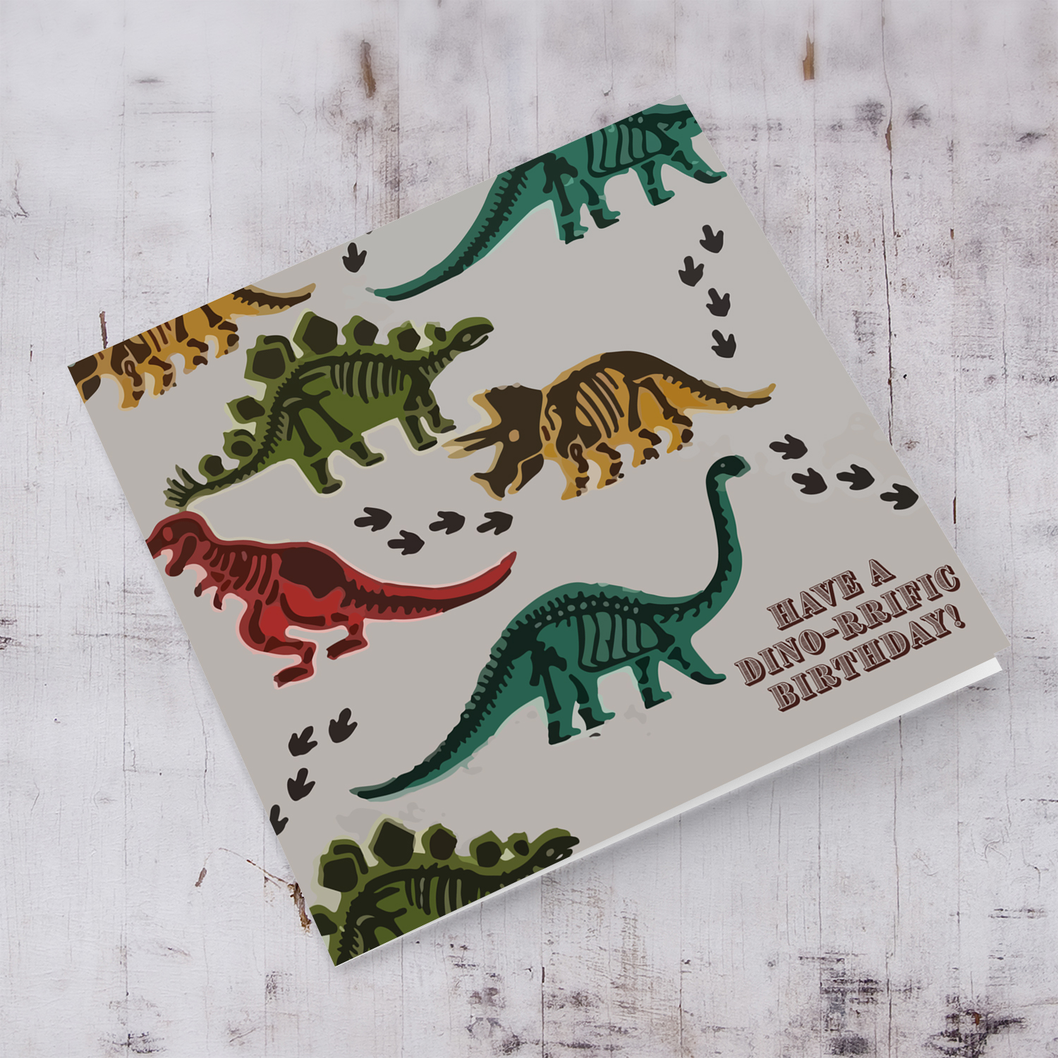 Dinosaur themed birthday card with footprints in English