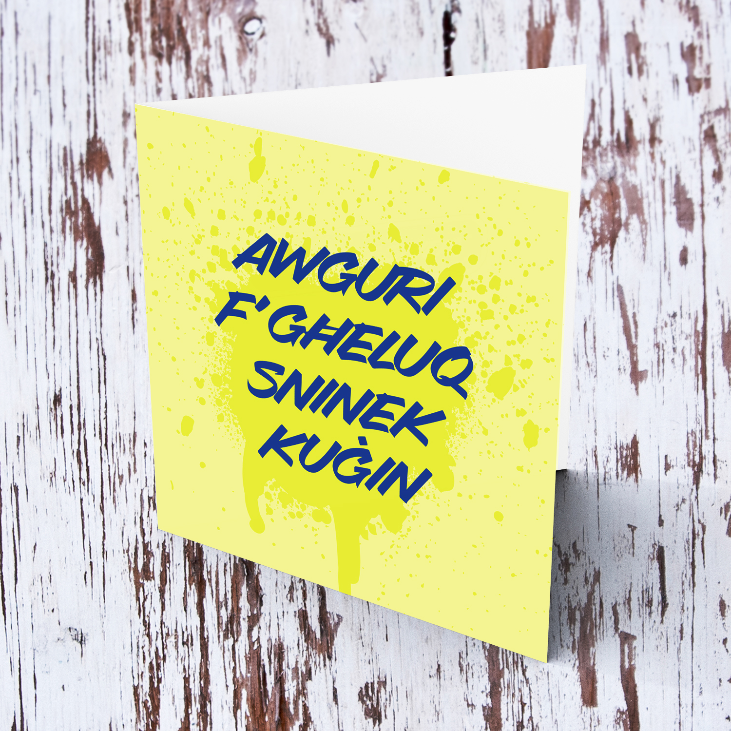 Yellow splattered paint background with blue text birthday card for cousin in Maltese