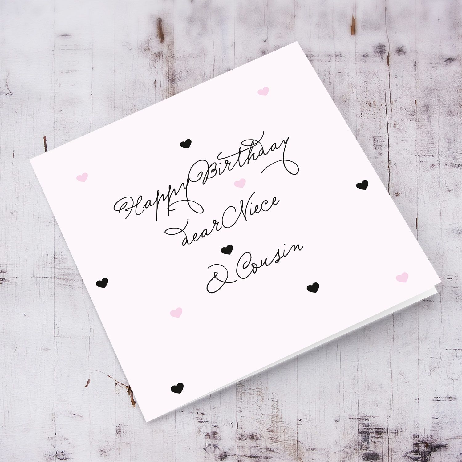 Light pink with scattered hearts birthday card for niece & cousin in English