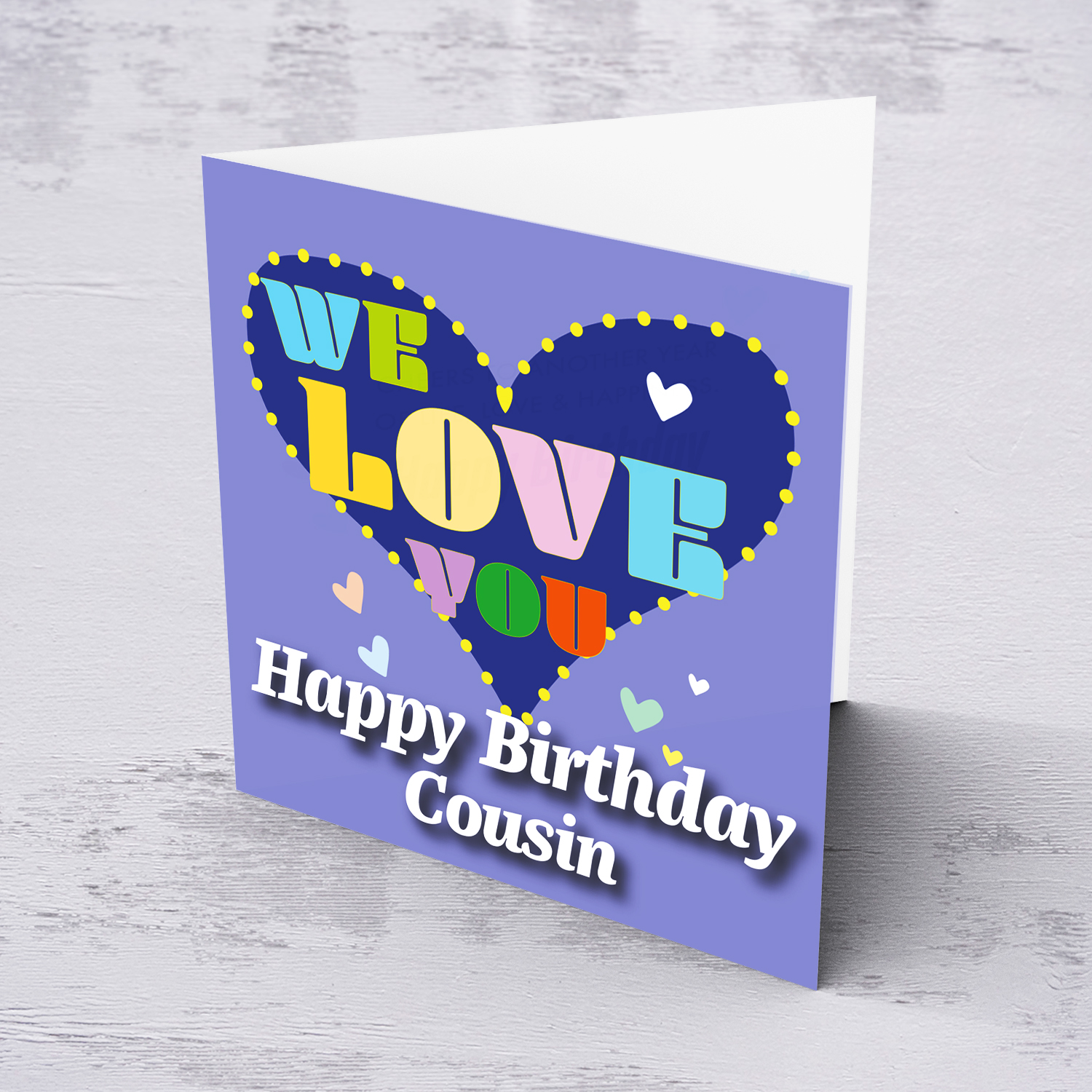 Purple background birthday card with big blue heart for Cousin, with a big WE LOVE YOU and scattered hearts in English