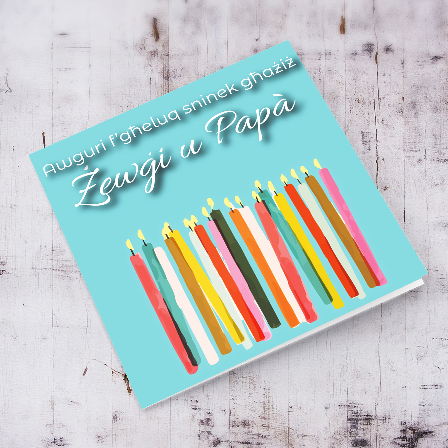 Candle themed birthday card in light blue / turquoise background for husband and dad in Maltese