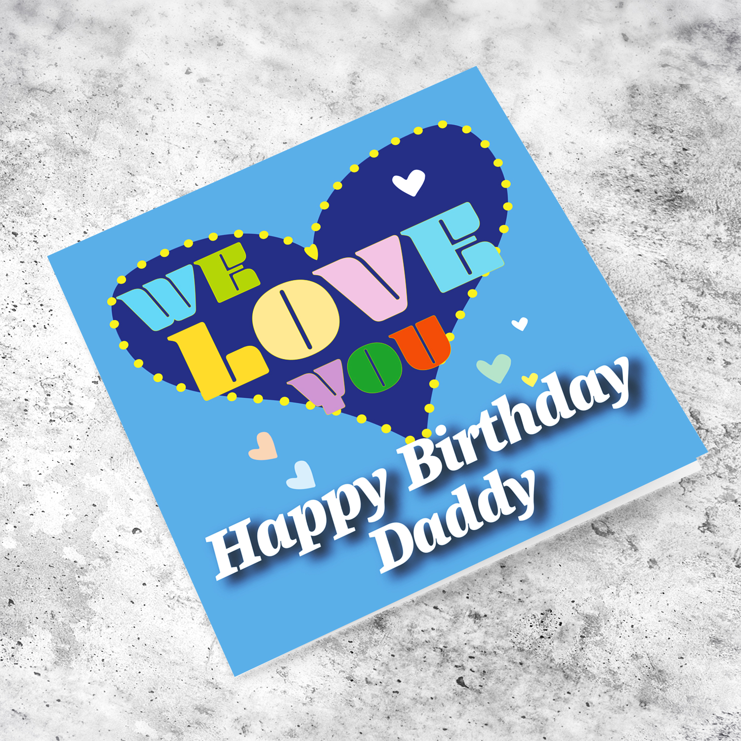 Blue background birthday card with big blue heart for daddy, with a big WE LOVE YOU and scattered hearts in English