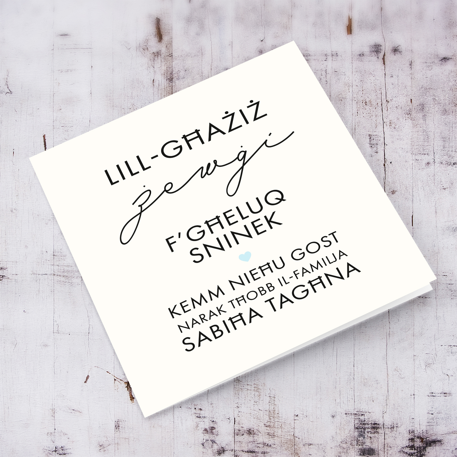 Minimalist birthday card for husband with a special message featuring a light blue heart in Maltese