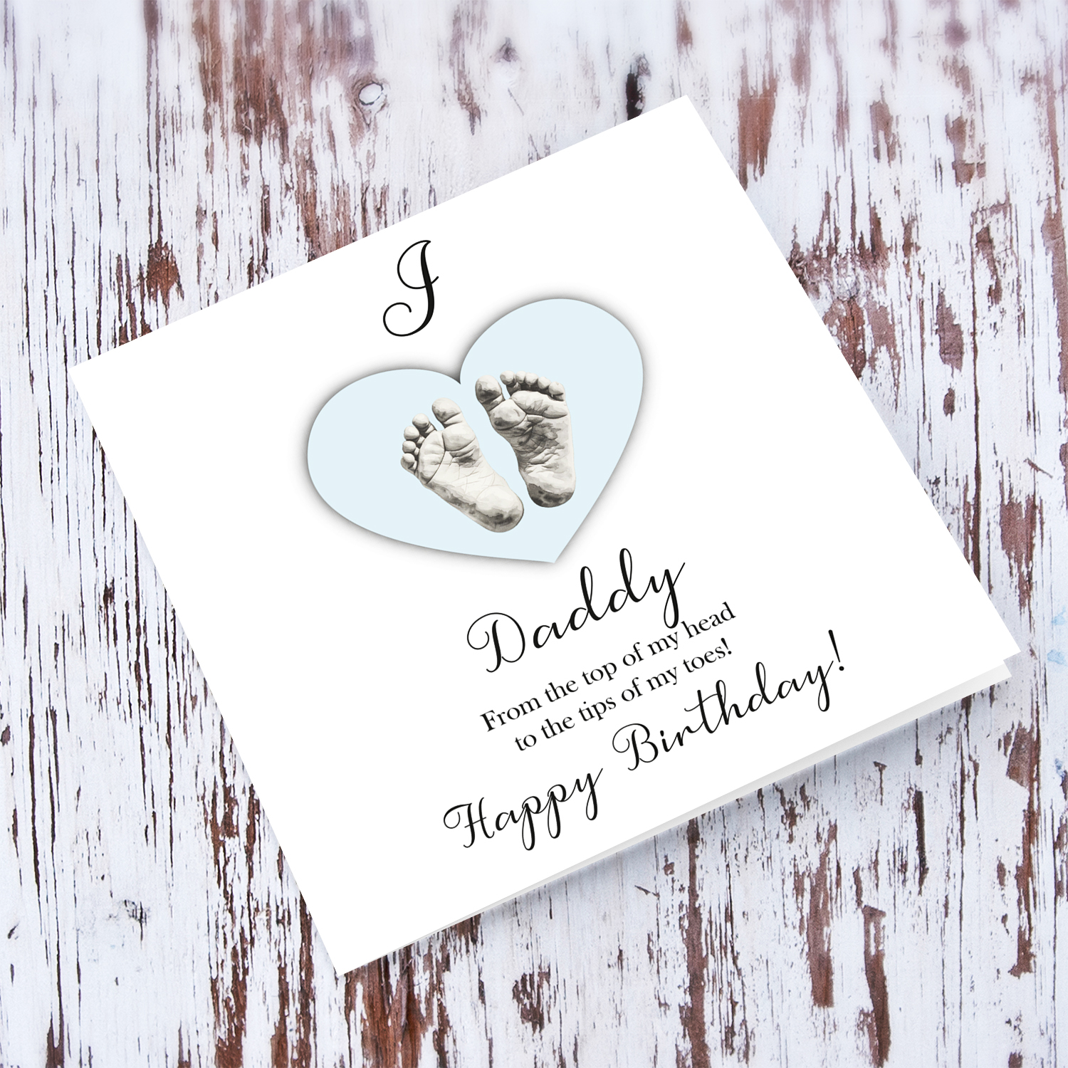 A cute baby footprint birthday card for daddy, I love daddy, in a light blue heart in English