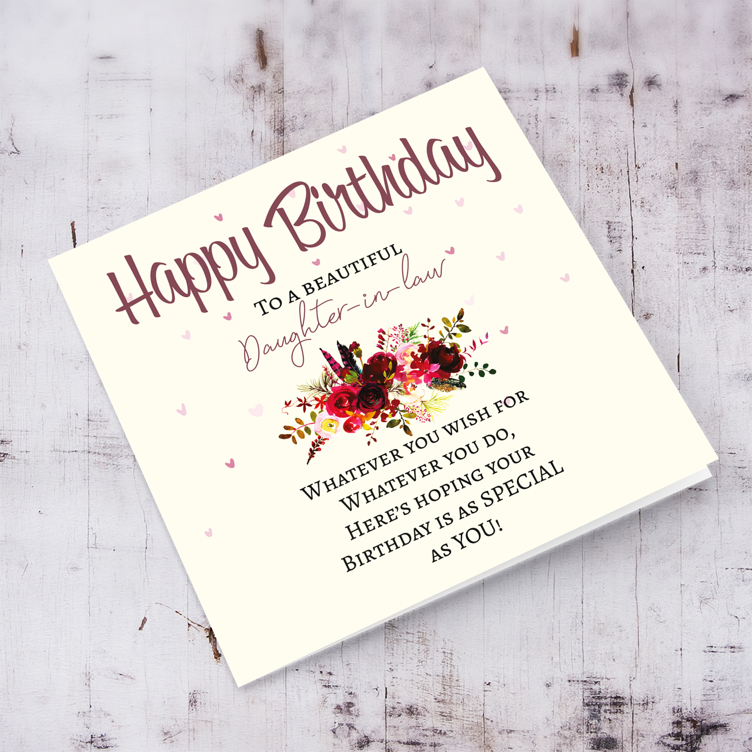 Daughter-in-law - A birthday card with a special message with red tones colours and scattered hearts for daughter in law in English